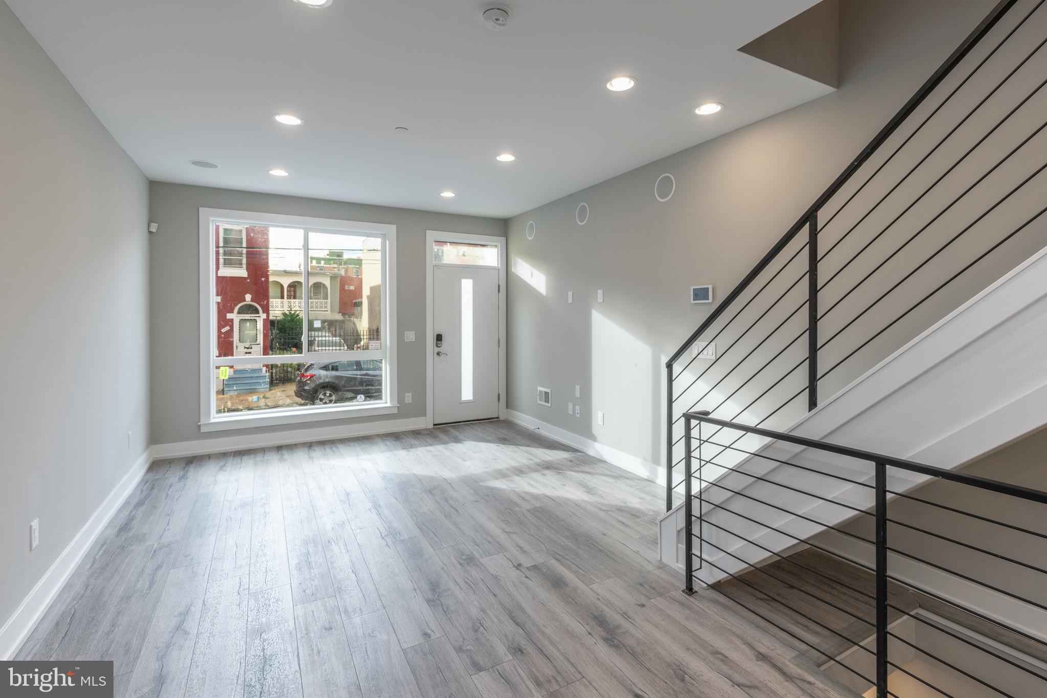 Welcome to 2525 N Hancock St, a beautiful new construction home being built in the heart of booming West Kensington.  If your not familiar with the direct pocket of the City, please reach out as their is hyper development going on within a tight three block radius of this beautiful home.  We would be happy to give you a quick tour of this area and show you through this beautiful home.  Only a 5 minute drive from the heart of Northern Liberties and Fishtown.  This 4 bed | 3 full bath home has approx. 2,400 sq ft of meticulous attention to detail and top of the line finishes. Step inside the open floor plan that features hardwood flooring throughout, great natural light due to the large oversized windows, gourmet kitchen that feature custom cabinets, granite countertops, stainless steel appliances and half bath. Venture to the second floor to find the first of two large guest bedrooms with plenty of closet space. Full bathroom on the 2nd floor and laundry room. The entire third floor makes up the master bedroom suite which is a MUST SEE. You are greeted with a wet bar including sink and wine fridge, which is perfect for your rooftop deck entertaining! Tiered master bedroom ceiling and plenty of space in the walk-in closet. Enter the master bathroom to find dual vanity sinks and gorgeous walk in shower. As you open the door to the roof deck you have beautiful unobstructed views of the entire city skyline. Surround sound system on roof deck as well. This home comes with all the extras as well: security system, keyless entry, surround sound speaker system throughout, wet bar. 10 year tax abatement and one year builder warranty. An exceptional home at an exceptional value.  Get in early as this price point will surely appreciate based on all the development currently happening and in the works within the next 12 months.  Call us for more info.