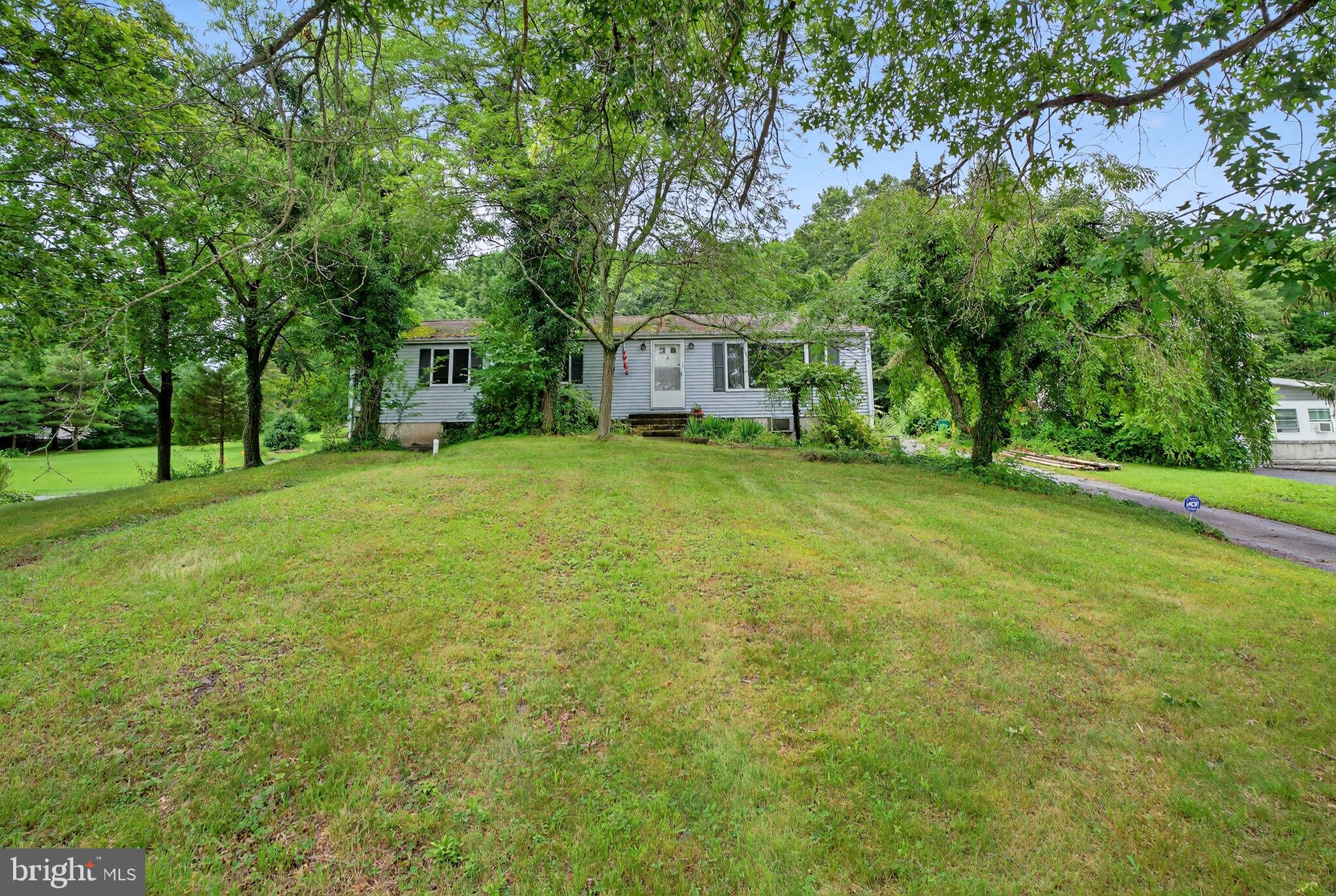 Located in the Pottsgrove School District, this charming 3-bedroom, 2.5-bath home offers a wonderful blend of comfort, privacy, and thoughtful updates. Set on a spacious .69-acre lot, the property backs to 37 acres of protected preserve land, providing lasting tranquility and scenic natural views. Inside, the home features approximately 1,350 square feet of living space, including a full basement with a laundry area and a convenient half bath. The oversized kitchen has been enhanced with a stylish backsplash and includes newer appliances, making it a great space for entertaining. The dining room is bright and welcoming, highlighted by a lovely bay window that brings in natural light. An oil furnace provides reliable heat, while central HVAC keeps the home cool in warmer months. A private parking pad accommodates up to three vehicles. Outdoor living is made even more enjoyable with a deck, a greenhouse for your gardening needs, and a unique outdoor shower—perfect for summer days or post-gardening cleanups. This home offers a rare combination of modern comfort and natural beauty, creating a peaceful retreat you’ll love coming home to.
