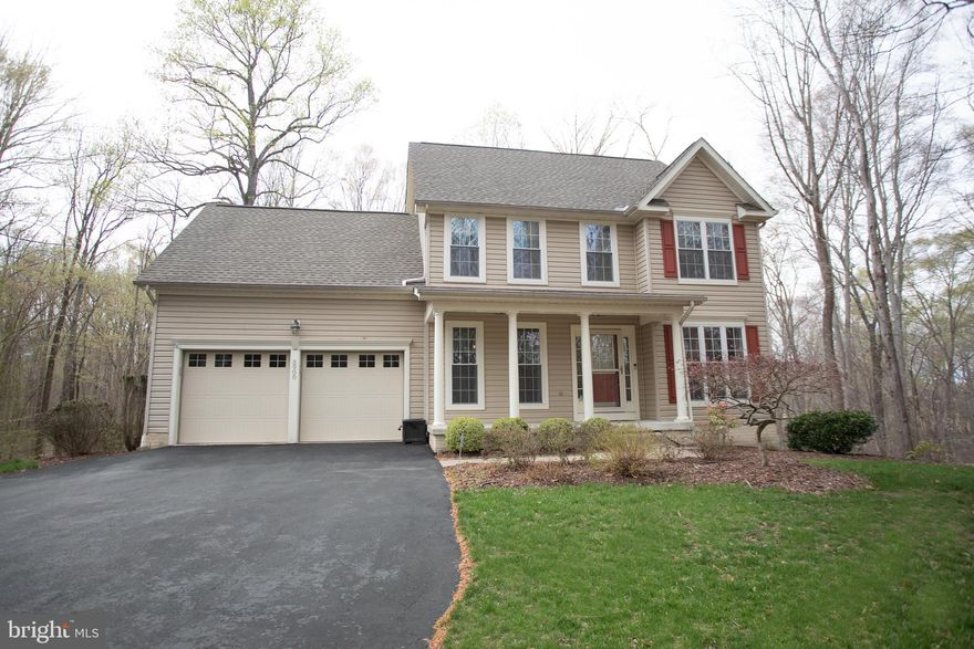 Welcome to this charming four-bedroom colonial home, offering classic elegance and comfortable living. Step inside to discover beautiful hardwood flooring that flows seamlessly throughout the main level. The layout features a formal dining area, perfect for hosting gatherings, and a formal living room, ideal for quiet relaxation. The heart of the home lies in the functional kitchen, boasting sleek Corian countertops and opening to a family room with a warm, wood-burning fireplace – perfect for cozy evenings.

Upstairs, you'll find a spacious owner's suite, complete with its own private full bath, providing ample space and privacy. At the end of the hall is another very large bedroom, offering generous space, with a full bathroom conveniently located just outside its door. Two additional bedrooms are also located on this level. A convenient half bath on the main level adds to the home's functionality.

Extend your living space outdoors onto the deck, accessible from the kitchen/family area, and enjoy the shade and ambiance of a delightful gazebo. The property is nestled amongst mature trees, creating a serene and private atmosphere.

The unfinished basement presents a blank canvas, allowing you to design and customize the space to your exact specifications, offering the potential for immediate equity.

This colonial gem combines traditional style with modern comforts, creating a perfect haven for family living and entertaining.