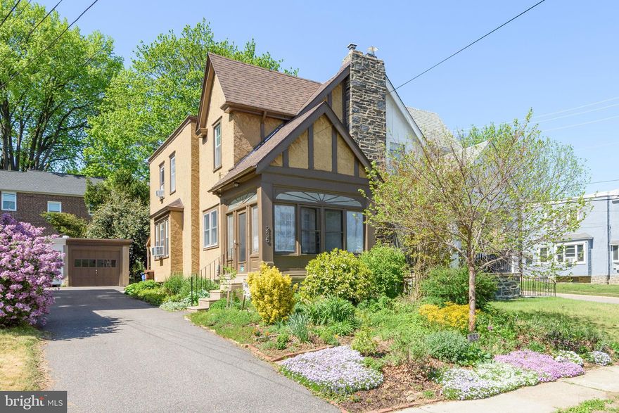 A true blend of character and comfort ready for its next chapter. Tucked away on a quiet street in the heart of Lansdowne, this twin home blends character, warmth, and everyday functionality just steps from Hoffman Park. Offering 3 bedrooms, 1.5 baths, and 1,252 SF, the home features hardwood flooring throughout and a spacious living area anchored by a large stone fireplace that creates a cozy focal point. The kitchen showcases unique character with stainless steel countertops and double sink, a tin tile backsplash, and a butcher block-topped island (included in the sale), along with all appliances for added convenience. A recently added first-floor half bath and hall closet enhance everyday livability. The enclosed front porch provides a welcoming entry space, ideal for relaxing. Out back, enjoy a rear yard with a partially covered paver patio, ideal for outdoor entertaining.  A detached 1-car garage adds valuable off-street parking and extra storage. With its timeless appeal, thoughtful updates, and tucked-away setting, this home presents a wonderful opportunity in a desirable and charming neighborhood setting.