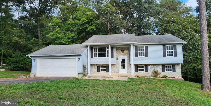 Spacious Split Foyer located on quiet side street. Main floor offers open floor plan in the living area. Extra family room with fireplace on lower level.  Front loading garage is large and has interior access. Sold AS IS.