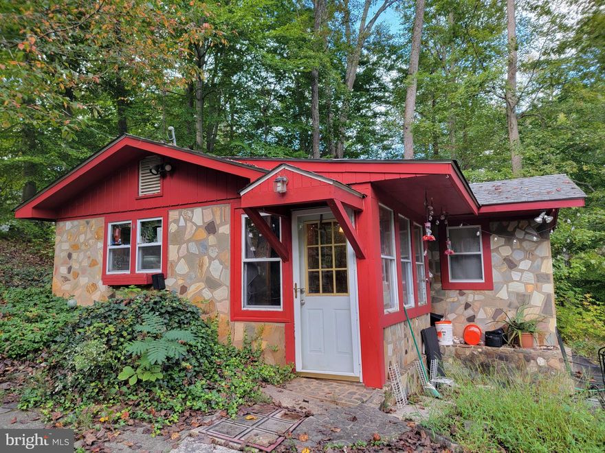 Nature retreat on the Bull Run River. Coming Soon! Lake Drive cabin is only minutes to Fairfax County and Manassas City. Secluded feel with the convenience of city living on a 1.43+/- acre lot.  Interior photos coming soon. Enjoy the change of the seasons in this tranquil home setting. Contact us ASAP for an appointment to view 7717 Lake Dr Manassas VA 20111. No HOA, Flood insurance required. Note for those with mobility difficulties** there are steps down from the driveway to the house.