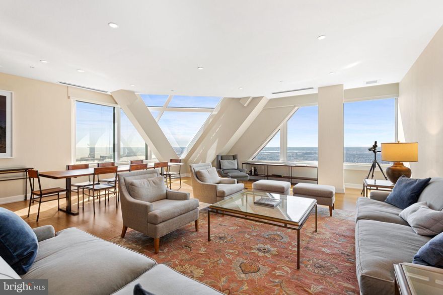 Luxurious skyline home on the 53rd floor of The Residences at Two Liberty Place by architect Cope Linder and Furey Design. The Residences at Two Liberty Place are widely described as the highest residential address between Philadelphia and Chicago. 3 spacious bedrooms plus den and 3.5 baths with unparalleled East, South, and West views of Philadelphia, the Schuykill River, the Delaware River (and where they meet) and beyond! Mint condition residence constructed from raw space in 2016 with high-end finishes throughout. This sophisticated residence is complemented by finishes such as Calacatta marble, Snaidero cabinetry, Miele appliances, Sub-Zero refrigerator and Nest thermostats. Custom Lutron electric Smart Shades throughout with remote controls. Primary bedroom suite with walk-in-closet and marble 4-piece bath. Spacious den currently used as a media room and home office. Pet-friendly building and state-of-the-art amenities on the newly renovated 37th floor include 24/7 fitness center, yoga studio, endless indoor pool, massage room, steam room, sauna, conference room, sitting room with views of William Penn on City Hall, resident lounge with fireplace,  billiards and kitchen, business center, 24-hour concierge services and chauffeur driven town car. On-site valet or self parking is available for an additional cost. Fantastic location in the heart of Center City with easy access to the Shops at Liberty Place, near hospitals, universities, City Hall, Comcast Centers, restaurants, entertainment, shopping and all Center City has to offer.