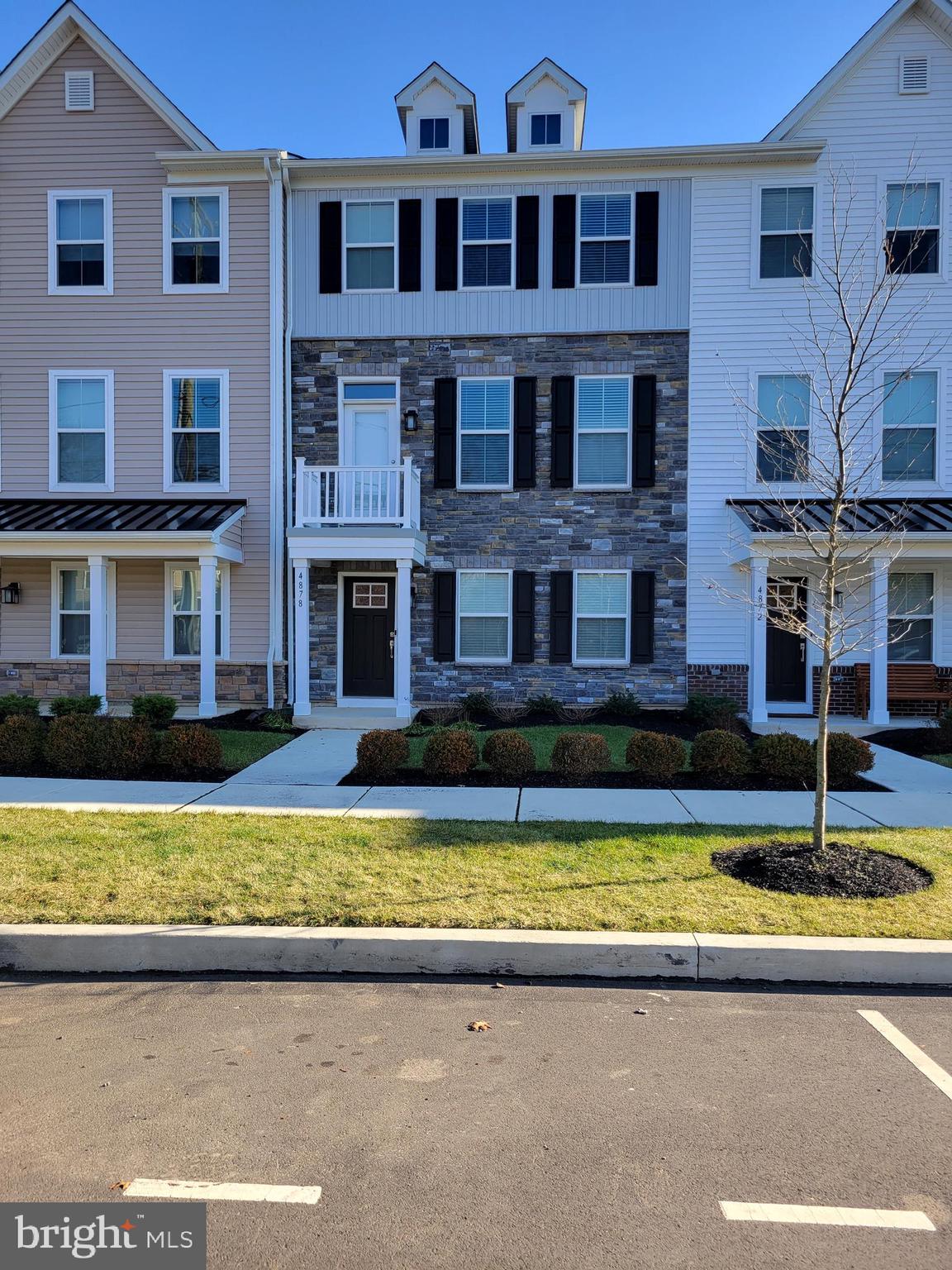 Do not wait to schedule an appointment to see this beautiful Pipersville rental. This almost new gorgeous townhouse is waiting for you to view. It is a few years old and part of the Lennar townhome community of Lantern Ridge, although it still shows as new. This unit is the Harper model. Pull up to this modern style townhome with a beautiful stone front and tastefully selected siding. You will notice the nice landscaping in the front. If you park out front, you will enter into the Main level where there is the 2 car garage access into the home as well as a Bedroom that has it's own full bath with a walk in shower. This could be used for in-laws, the primary or a guest room. Access to the 2 car garage is on this floor. Garage is rear facing and there is also driveway parking behind the home. Head on up to the 2nd level where you will find the main living space. This level has the Living Room, a half bath, the Kitchen, and Dining Room. The Living Room is of nice size and is open to the Kitchen. The kitchen is to die for! This kitchen is white and has amazing granite countertops, lots of storage in the cabinetry, an island that is enormous and has plenty of storage underneath. The appliances are all stainless steel. There is a gas cooktop, refrigerator, dishwasher, oven, microwave and a rangehood. White subway tiles are the backsplash for this amazing kitchen. Nothing was overlooked when they put this kitchen together. The flooring is a dark plank style that really compliments the brightness of the rest of the kitchen. Even though this home has natural lighting, it has recessed lighting as well. The Dining Room is right next to the Kitchen and has direct access to the deck for outdoor entertaining. Don't forget the walk in pantry if you need more storage! Go up one more level to find the Primary Bedroom Suite complete with tray ceiling, primary bathroom with a walk in shower and dual vanities. You will also find the 2nd and 3rd bedrooms that share a hall bath and has a tub. The laundry room is also on this level. Snow removal and lawn care is included as well as trash. Landlord pays the HOA fees. If you haven't heard enough to schedule an appointment, then how does walking to restaurants and stores sound? Public transportation nearby for commuters. Landlord is looking for smoke free tenants. Pets are on a case by case basis and landlord reserves the right to decline based on size, breed or number of pets. Pictures are from 4878 Stump Road prior to current tenant moving in. To protect tenants belongings, etc. new pictures will only be updated after they move out.