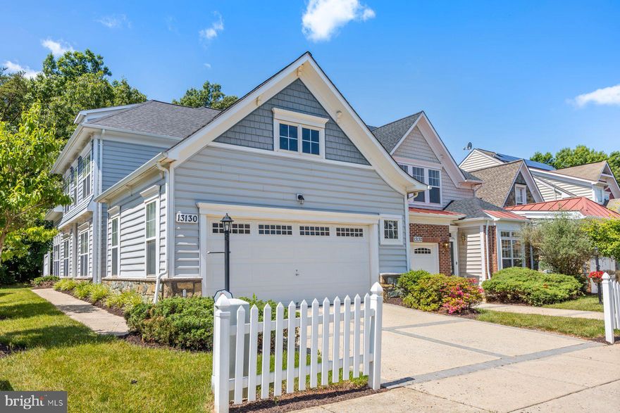 Welcome to 13130 Brooktree Lane in the Victoria Falls resort community conveniently situated in Laurel, MD.  Come home to your personal oasis for comfortable living in this tucked away and vibrant community!  This home is loaded with all the features you would want.  At perhaps one of the largest and most updated units, 13130 has two large bedrooms upstairs together with a full ceramic bath.  The spacious first floor has an office/bedroom just off the foyer, a large primary bedroom with views of the lush hardwood forest and a primary bathroom with shower and soaking tub!  The roomy living room has plenty of square footage for gathering and entertaining with a full bath just down the hall too!  The kitchen is upgraded with granite countertops, a new stainless steel refrigerator and a new stainless steel dishwasher as well.  Adjacent to the kitchen is the eat-in dining area which has a sliding glass door for the beautiful mornings to enjoy a breeze and hear the birds make their music!  The laundry room and storage closet is adjacent to the interior garage door which leads to the very spacious two car garage with an additional room for extra storage.  This home is in amazing shape!  Terrific windows, HVAC system and a NEW ROOF with architectural shingles for a long lasting worry free feature.  The location of this home is perfect backing up to woods in a quiet side of the village. 
If you are downsizing, moving close to grandkids or are just looking to join a vibrant and active 55+ community come visit and buy! Situated in the heart of Victoria Falls, your  home will be convenient to the parks, walking trails, tennis courts, pool, fitness center and all of the community's clubs and activities. Best of all, you will enjoy the soothing sound of the fountains at the lake. A variety of recreational opportunities will await you at the spectacular Resort Club. Stay in shape in the 55 foot indoor salt water pool and state-of-the-art fitness center, where a professional trainer is available to develop a custom health program designed specifically for you!