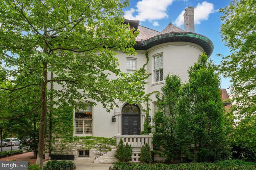 Welcome to 1823 Phelps Pl NW, a distinguished residence in the heart of Kalorama, one of Washington, D.C.’s most prestigious neighborhoods. This architectural masterpiece was built in 1905 in the Romanesque Revival style of pre-eminent American architect Henry Hobson Richardson. It is historically significant as having been built for the president of the Lincoln National Bank. Blending historic grandeur with modern luxury, the home offers an exceptional setting for both elegant entertaining and comfortable living. 

The striking entry vestibule leads to a foyer adorned with original paneling and a coffered ceiling. Sun-drenched living spaces feature soaring 11’+ ceilings, exquisite moldings and restored pocket doors. The chef’s kitchen boasts a large center island, high-end Sub-Zero, Viking and Bosch appliances, and a sunlit breakfast room with French doors to the terrace. There is also a sophisticated family room (or second formal living room) with a dramatic marble fireplace surround and built ins. The rooms flow seamlessly into the elegant, large dining room. A stunning powder room and three gas fireplaces complete the main level. The elevator serves all four levels of the house.  

The second level hosts the expansive owner’s suite with a gas fireplace, spa-like Waterworks marble bath, large walk-in closet, and an extraordinary second closet/ room-sized dressing room with custom built-ins and a beverage center. Two additional en-suite bedrooms and a laundry room provide convenience and comfort on this level. 

The third level is a stunning retreat, featuring the fourth and fifth bedrooms, two full baths, a sitting room, and a bonus room that could be a private office or a playroom. The skylight provides light from above, down to the main level. 

The lower level of the house offers an array of lifestyle amenities, including a media room, full-size gym, in-law suite with separate entrance and full bath, temperature-controlled wine cellar, powder room, and access to the two-car garage with ample storage. The private garden is an entertainer’s paradise, featuring a dining area, fire pit, built-in grill station, pergola, fountain, and lush landscaping.  

Kalorama is graced by various notable homes and embassies and ideally located close to the Dupont and Woodley red line Metro stops, the famed Sunday Dupont Farmers Market, The Phillips Collection, a myriad of restaurants, shops, cafés, and galleries, and other conveniences. Rock Creek Park is also just a few blocks away on foot or via car.