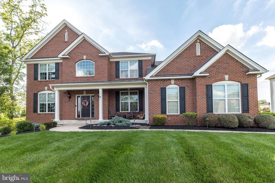 **OPEN HOUSE: Saturday, June 15, 12:00-2:00PM. Step into luxury at 602 Meehan Drive, a 4-bed, 2.5-bath stunner situated on a beautifully landscaped, picturesque lot in the highly desired neighborhood of Warrington Glen. This stately brick-front Everette Gettysburg Manor home, built by Toll Brothers in 2015, spans 3,244 square feet and has been exquisitely upgraded throughout and meticulously maintained with impeccable attention to every detail. Located in the prestigious Central Bucks School District, this home offers easy access to shopping, restaurants, and main highways, ensuring a convenient and vibrant lifestyle. As you drive up the expanded driveway, you’ll notice the outstanding curb appeal and the gently curved walkway leading to the inviting covered front porch. Step inside and be greeted by a bright, open-concept floor plan, sun-filled rooms, and a warm, welcoming color palette that today's buyers highly desire. The soaring two-story foyer features a turned oak staircase, a lovely chandelier with an electronic lift for easy cleaning, and exceptional custom tile flooring that flows into the kitchen and breakfast area. To the right, a convenient double-door home office showcases beautiful built-in bookcases to display your cherished books and photos, along with elegant wood flooring. The formal living room flows seamlessly into the formal dining room, creating the perfect gathering space for your next holiday meal. Both rooms feature solid wood flooring, crown molding, and chair rail, adding a touch of elegance. The heart of the home is undoubtedly the stunning chef's dream kitchen. It boasts dark espresso upgraded cabinetry, granite countertops with a lovely tile backsplash, a huge double sink, stainless steel appliances with a wall oven/microwave combination, an oversized gas cooktop, premium lighting and fixtures, and a large pantry closet. The expanded breakfast area has plenty of room for your largest farmhouse table, a skylight, and a French door that opens to the picture-perfect paver patio with automatic landscape lighting. This wonderful outdoor living space is ideal for hosting summer barbecues or relaxing and enjoying the tranquil views of the manicured lawn and landscaping in your fully fenced backyard. Adjacent to the kitchen, with unobstructed views, is the spacious and expanded family room. It features new hardwood floors, a vaulted ceiling, a floor-to-ceiling stone hearth with a Heatilator gas fireplace, and is accented with a triple box bay window that bathes the room in warm, natural light. Rounding out the first floor is a powder room and a large laundry room with a wash tub and entry to the oversized two-car garage. Make your way up the solid wood turned staircase to the second floor, where hardwood flooring runs seamlessly throughout the hallway. To your right, enter through the double doors into your beautiful retreat—the main suite, an oversized haven with a coffered ceiling and lovely chandelier. There is a dressing area with a makeup vanity and a huge walk-in closet. The well-appointed main bathroom boasts a vaulted ceiling, upgraded tile throughout, a walk-in shower with a seamless glass door, a double vanity, and a luxurious corner soaking tub—the perfect place to relax and unwind. Three additional well-sized bedrooms, each featuring a large closet, share the full hall bathroom with a tub/shower combo. The gigantic unfinished basement, with an expanded full area under the family room, nine-foot ceiling height, passive radon system, water-powered backup sump pump, and an egress window, offers the perfect future space for finishing and plenty of room for all of your storage needs. Additional features include: two zones of heating and cooling, a security system, and an exterior irrigation system. With nothing left to do but move right in, this beautiful home is ready to offer you a lifetime of cherished memories. 1 Year Home Warranty included for added piece of mind.