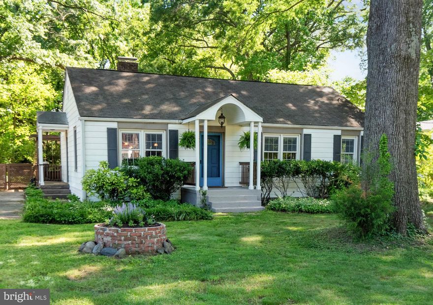 You’ll love this charmingly updated cottage-style home on over 1/2 acre! And if you like to garden, you’ll appreciate  the perennials and shrubs from a prior owner who was a master gardener, not to mention a beautiful fish pond with water filtery, deck, brick-lined herb garden, waterfall, sculpture accent, fenced rear yard, greenhouse (as-is) and three sheds  (convey as-is). ****** The current owner installed a new  energy efficient HVAC system, an outdoor tankless hot water heater in 2019,  and a gourmet kitchen in 2021. ****** The kitchen has many custom finishes like pull out trash and recycling bins, lighted drawers and an electric cooktop (with a preinstalled gas line if new owner wants to convert to gas), Moroccan wall tiles, Caesarstone quartzite countertops, under cabinet lighting, recessed lights, extra deep stainless sink, high flexible faucet with sprayer, and stainless steel appliances including Whirlpool refrigerator with icemaker, wall oven and built-in microwave. ***** Remodeled master bath (2021) features  lnew fixtures and an extra  large walk-in shower with  floor-to-ceiling ceramic tiles, and upgraded shower head.  MBR has custom  designed walk-through closet..*****  Remodeled hall bath (2022)  features new fixtures, lighted vanity, tiled walls and floor, tub and shower combination with rain shower head plus handheld shower fixture, and full sized stack washer and dryer with steam. (2018). *****  Third bedroom is currently configured as a home office, but the wall unit converts to a queen Murphy bed and there are two built-in closets with drawers. *******  The living room opens to spacious covered porch with a gas hook up for a grill. The Samsung  1080p 60” wall-mounted television,  amplifier and  surround sound speakers convey. A  greenhouse window faces the serene rear yard. The current owner is using the front room with a wood-burning brick fireplace as a formal dining room, but it could be converted back to a living room and the current living room could be used as a family room with a dining area. ******  Lots of storage including pantry and separate broom closet in kitchen, two coat closets, hall shoe closet, and pull-down steps to attic. ****** Nearby is the highly rated Inova Mount Vernon Hospital, Fairfax County Public Library, the popular Hollin Meadows Elementary, Huntley Meadows Park, Costco, Aldi, Walmart, Home Depot and many other convenient businesses and restaurants and the Wednesday Farmers Market is very popular with the neighborhood.