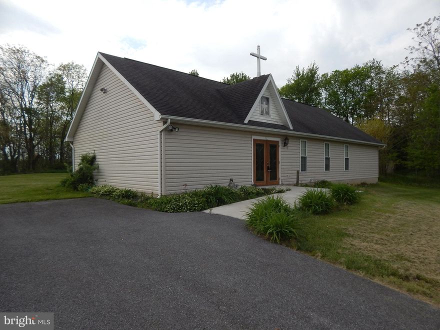 Built as a Church w/ a main sanctuary, kitchen, office, classroom, sound tech booth, & 2 half baths. Situated on 5 beautiful, usable, UNRESTRICTED acres, fronting a county road. Property could be used by another church, converted to a home, business/church retreat, day care ,commercial business location, or subdivided w/ planning office/health dept approval. All on one floor for wheelchair access.