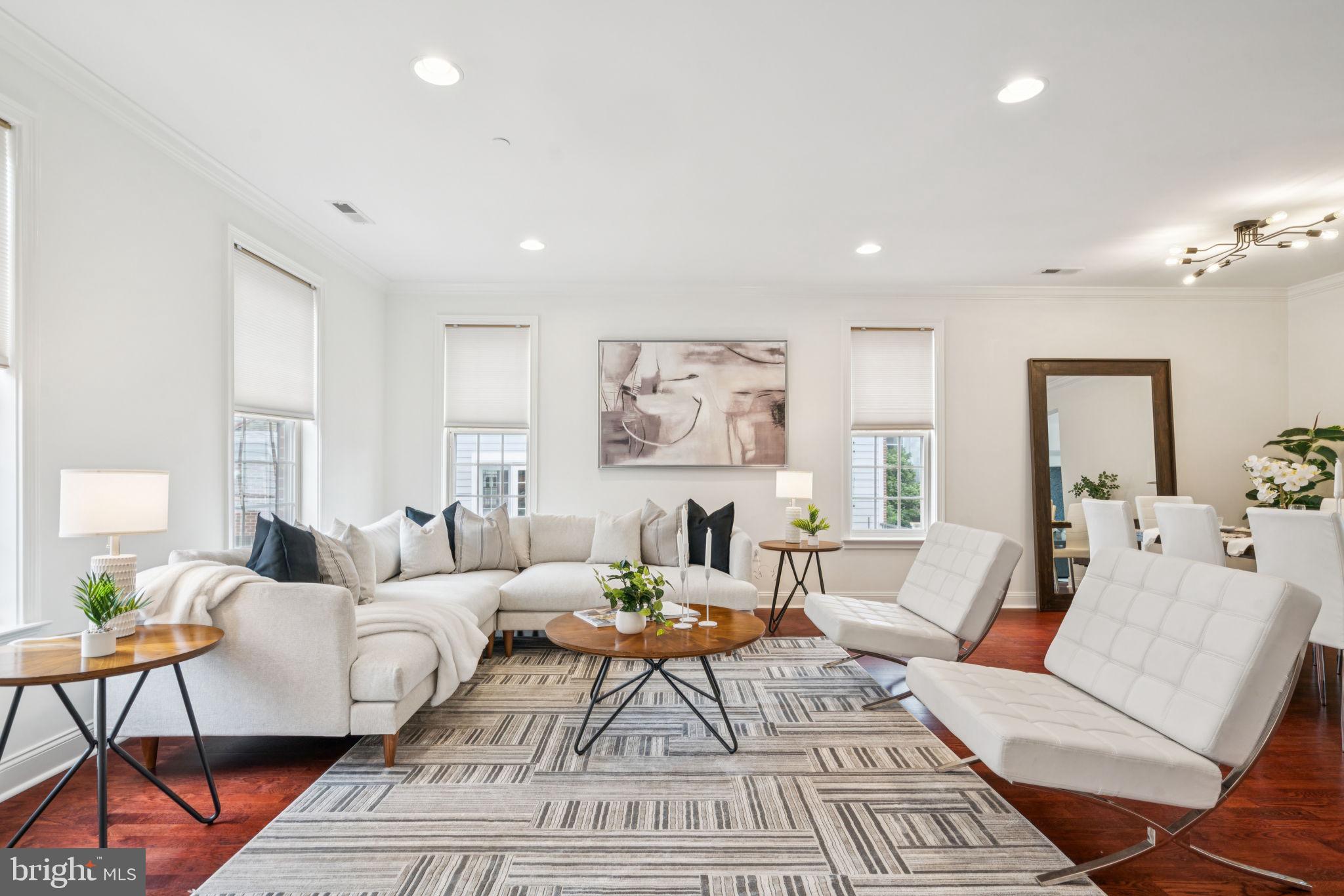 An exquisite opportunity to live in a rarely offered and highly coveted CORNER UNIT with a TERRACE and PRIVATE GARAGE PARKING in Naval Square! This sprawling, bi-level, three-bedroom, two and a half bathroom home truly has it all. Upon entering the main level from your private garage, you find an expansive living and dining area showcasing a wall of windows with MULTIPLE EXPOSURES, ensuring no shortage of natural light, and beautiful gleaming hardwood floors. The chefs kitchen offers a multi functional nook and features stainless steel appliances, granite countertops, an abundance of cabinetry and a convenient breakfast bar. Sliding doors open up to a terrace perfect for your morning coffee or al fresco dining. A powder room completes the main level. The third floor offers three bedrooms and two full bathrooms with new carpet throughout. The main bedroom suite is generously proportioned and features ample closet space and an en-suite bathroom with double ceramic sinks and storage vanities, tub, and a separate shower with glass enclosure. The second bedroom offers high ceilings and an abundance of natural light with adequate closet space to match. The third bedroom gives you the flexibility to use as not only a bedroom, but could also serve as a playroom or office. Amenities of Naval Square include 24- hour security, a state-of-the-art fitness center, seasonal outdoor pool, sundeck, common room, manicured gardens, picnic areas, and guest parking. Situated on a lush 20 acre park-like setting, this pet-friendly residence is just a short distance to fine dining, one-of-a-kind shopping, and world-renowned cultural destinations. DREXEL, CHOP, PENN, University City, Schuylkill River Trail, and Rittenhouse Square are all a short walk away.