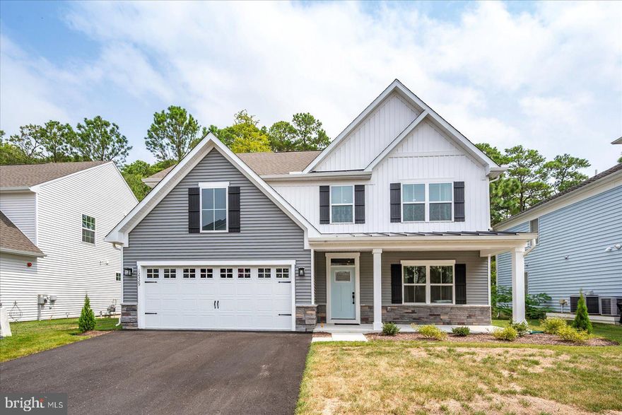 Exquisite newly constructed home, completed in 2024, offering 3 bedrooms, 2.5 baths, and 2,527 sq. ft. of impeccably designed living space. Located in the Landings in Bayside located off Rt. 611 and only 3 miles from Rt. 50 provides easy access to all that West Ocean City has to offer! This furnished residence showcases exceptional craftsmanship, high-end finishes, and thoughtful details throughout, creating a truly move-in-ready retreat.The first floor features an expansive open-concept layout with a sophisticated living room centered around a gas fireplace, a spacious dining area, and a chef’s kitchen designed to impress. The kitchen boasts quartz countertops, an oversized island with seating, premium stainless steel appliances, a gas range, 2nd oven with microwave, soft-close cabinetry, and a walk-in pantry. The luxurious primary suite on the main level offers a spa-inspired en-suite bath with dual vanities and a generous walk-in closet. Additional highlights on the first floor include a private office that may serve as a fourth bedroom, a powder room, a separate laundry room, and elegant luxury vinyl plank flooring throughout. Upstairs, you’ll find a versatile loft living area, two spacious bedrooms each with ceiling fans and walk-in closets, a full hall bath with a quartz double vanity, and a large storage room for added convenience.This home is further enhanced by modern amenities such as recessed lighting, a fire sprinkler system, a tankless gas water heater, and a 2-car garage. Combining timeless style with modern comfort, this property is the perfect blend of sophistication and functionality—an exceptional opportunity for discerning buyers seeking a truly turnkey home!  Bayside Community amenities include outdoor pool, indoor pool (open year round), club house, fitness center, tot lot, basketball & tennis court, bayside pier & Kayak launching. Per management company the HOA fees include trash pickup, lawn/shrub maintenance. The community's West Ocean City location is convenient to many restaurants, shopping, Marina, golf courses, amusements, Ocean City Beach & Boardwalk (5 miles away) & Assateague Island State Park (5 miles away). Come make this beach home all yours!