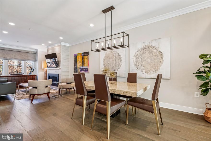 Welcome to this bright, luxury four-level townhome on a premier lot with an elevator in the Grosvenor Place facing a protected forest conservation.  This former model home and smart home comes with many extras including an energy-efficient dual-zone heating and cooling system with smart thermostat and tankless water heater.  

Built in 2021, it offers 4 bedrooms, 3.5 baths, 9-foot ceilings, wide-plank floors, a gas crystal fireplace, and a gourmet kitchen featuring a center island, gas cooktop, stainless steel upgraded Thermador WiFi enabled appliances, custom cabinets, and extra storage with built-in pantry wall with banquette seating offering 60% more storage. Floor-to-ceiling glass doors open to a sunny deck. The entry level includes a spacious foyer, French doors leading to a guest bedroom, a powder room, and rear access to a two-car garage. On the main level, the large kitchen flows into the dining area and family room with a fireplace. Custom window treatments and electric shades are installed throughout. Upstairs, the owners' suite has custom feature wall, a walk-in closet, and a spa bathroom with a dual sink vanity, a dual standard and rain shower, and a private toilet. This floor also has a second bedroom with an ensuite bath and laundry area. The top level features a wet bar, Thermador beverage center, sitting area opening to the rooftop terrace with treetop views, a private bedroom, and another full bath.  Move in and enjoy a great location that is walking distance to Grosvenor Metro, and Rock Creek Park trails with easy access to 495 and 270, the Bethesda Trolley Trail, and grocery stores like Grosvenor market, Whole Foods, Balducci’s and Giant. Downtown Bethesda and Pike and Rose are just a short drive away.