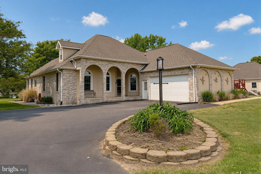 This beautiful custom built waterfront home is ready for your summer adventures!  Situated on 2 acres of land with waterfront views galore on St. Patrick's Creek.  .  As you enter the foyer, the open concept living style leads you to the living area and flex space perfect for a dining area/office/den.  Next you enter the kitchen with upgraded solid surface counters, upgraded stainless appliances, and lots of cabinets.   The doors from the breakfast nook open to the back deck.  Get your grill shined up and kick off the season with a barbeque or relax and enjoy the sounds of nature and beauty of the water.  The sunroom off the back of the house is perfect for a dining room, hosting gatherings and entertaining.  The main level primary bedroom has tray ceilings, a walk in closet and views of the backyard and waterfront.  The primary bathroom provides a soaking jetted tub and separate shower.   There are 3 additional bedrooms and a full bathroom connecting to one of the bedrooms.   Main level laundry/utility room has access to the 2 car garage and outdoor access.   The upper level bonus space could be used for an in law suite, apartment or room to spread out and create  your dream recreation area.  The upstairs includes a living room, bedroom and a full bathroom.  Wait there is more.....There is a detached 2 car garage with additional storage areas and separate driveway access.  Parking won't be an issue here!  And last but not least the private pier with approximately 210' of waterfront.  Swim, crab, fish, canoe or bring your boat and kick off summer with a bang.  Schedule your online appointment today.