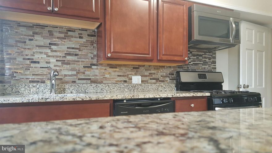 Welcome to a well remodeled house with everything you may desire for your house,  lovely 3 br. 2 ba Townhouse in Beechfield community. The House has it all, Hard wood floor, new  Full bath in lower level, and a walk up stairs. Stainless Steel appliances. Kitchen opened to the dinning room.Finished basement. Rear drive way for your parking 2 to 3 cars. Call  your agent.