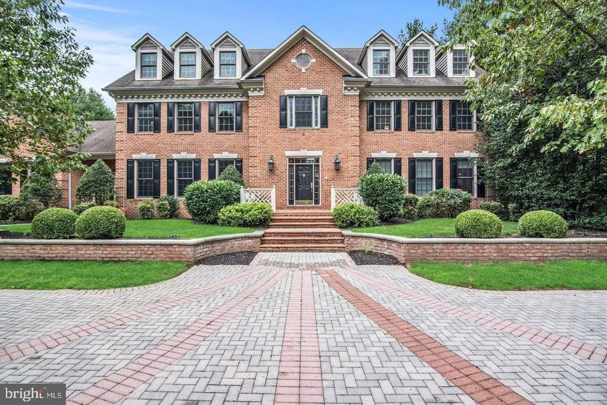 Iconic Estate | Hedgerow Estates – Clarksville’s Most Exclusive Enclave

Set on 3 acres of exquisitely curated grounds, this over 9,000 sq ft custom estate offers a rare combination of scale, craftsmanship, and resort-caliber living. Nearly $1 million in transformative upgrades have elevated the home to a level of finish and lifestyle seldom found in the market. A grand arrival begins with an expansive front courtyard, while the rear grounds showcase artfully designed French gardens, extensive hardscaping, and a newly built pool and spa, creating a private retreat ideal for both entertaining and everyday luxury. Residents also enjoy exclusive neighborhood amenities including a private tennis court, bike path, and tranquil lake. Inside, the home spans four fully finished levels with 8 bedrooms and 8 bathrooms, blending timeless architecture with modern sophistication. Features include new custom windows and doors, new wide plank matte hardwood floors, beautifully updated bathrooms, bespoke millwork, and luxurious custom lighting throughout. The updated chef’s kitchen is equipped with premium appliances, including a Sub-Zero refrigerator, while the main-level primary suite offers a spa-inspired bath and dual custom closets. The newly reimagined lower level rivals private clubs, featuring a wine cellar, entertainment bar, expansive recreation spaces, and a custom wellness center with gym and spa-like amenities. The rare fourth level adds exceptional flexibility with a second large executive office, lounge space, and private au pair suite. A one-of-a-kind estate where architectural presence, meticulous upgrades, and resort-style amenities converge in one of Howard County’s most coveted settings.