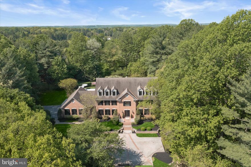 Iconic Estate | Hedgerow Estates – Clarksville’s Most Exclusive Enclave
Set on 3 acres of exquisitely curated grounds, this over 9,000 sq ft custom estate offers a rare combination of scale, craftsmanship, and resort-caliber living. Nearly $1 million in transformative upgrades have elevated the home to a level of finish and lifestyle seldom found in the market. A grand arrival begins with an expansive front courtyard, while the rear grounds showcase artfully designed French gardens, extensive hardscaping, and a newly built pool and spa, creating a private retreat ideal for both entertaining and everyday luxury. Residents also enjoy exclusive neighborhood amenities including a private tennis court, bike path, and tranquil lake. Inside, the home spans four fully finished levels with 8 bedrooms and 8 bathrooms, blending timeless architecture with modern sophistication. Features include new custom windows and doors, new wide plank matte hardwood floors, beautifully updated bathrooms, bespoke millwork, and luxurious custom lighting throughout. The updated chef’s kitchen is equipped with premium appliances, including a Sub-Zero refrigerator, while the main-level primary suite offers a spa-inspired bath and dual custom closets. The newly reimagined lower level rivals private clubs, featuring a wine cellar, entertainment bar, expansive recreation spaces, and a custom wellness center with gym and spa-like amenities. The rare fourth level adds exceptional flexibility with a second large executive office, lounge space, and private au pair suite. A one-of-a-kind estate where architectural presence, meticulous upgrades, and resort-style amenities converge in one of Howard County’s most coveted settings.