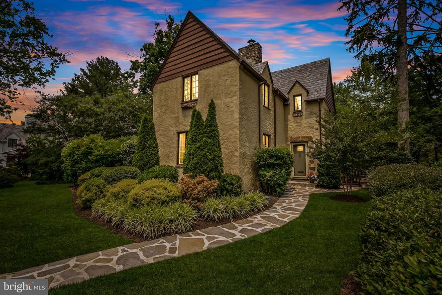 Introducing 310 Taplow Rd, an exquisite residence nestled within the prestigious Homeland neighborhood in Baltimore. This architectural masterpiece, designed in the enchanting English Cotswold style, stands as a testament to timeless artistry. The harmonious blend of wood and stucco creates a captivating facade that seamlessly integrates with the surrounding historic ambiance, evoking a sense of refined grandeur.

Offering 4 spacious bedrooms, 2 full bathrooms, and 2 half bathrooms, 310 Taplow Rd offers an abundance of space for gracious living. As you pass through the picturesque front gardens and enter through the custom African Mahogany front door, your eyes are immediately drawn to the original hardwood floors, ornate trim work and built-in shelving. The living room is spacious and natural light pours in through the large, brand new windows. The formal dining area is perfect for hosting holiday events or weeknight dinner parties and flows nicely into the spacious kitchen. 

The kitchen was recently renovated and includes antique-style cabinetry, showcasing a harmonious fusion of modern conveniences and tasteful aesthetics. Glistening countertops, top-of-the-line GE Cafe appliances, and ample storage space create a culinary haven fit for the most discerning of chefs or intimate gatherings. The main level is completed with a powder room neatly nestled behind the entryway door. 

Upstairs includes two generously sized guest bedrooms with spacious closets, a third guest bedroom/home office, and a recently updated guest bathroom. The primary suite offers a large footprint and includes multiple closets, an en-suite bathroom, and original hardwood floors and is drenched with natural light. 

The finished basement is an ideal space for a home office, recreational area, or play room and offers ample storage space, access to the utilities and a bonus half bathroom. 

Outside, a meticulously manicured landscape envelops the property, bestowing an aura of natural serenity and further enhancing its regal appeal. The impeccably maintained grounds serve as an idyllic backdrop for outdoor relaxation, perfect for savoring precious moments with loved ones. Multiple entertainment spaces are available outside and include a bluestone patio that will evoke feelings of a French bistro, a large yard for outdoor play and an orderly garden. 

An exceptional feature of this remarkable property is the rear load two-car garage and expansive parking pad, a rarity in this historic neighborhood. 

An extraordinary opportunity awaits to claim ownership of this unparalleled residence, where timeless splendor meets contemporary indulgence. Embark on a journey to experience the everlasting beauty of 310 Taplow Rd.