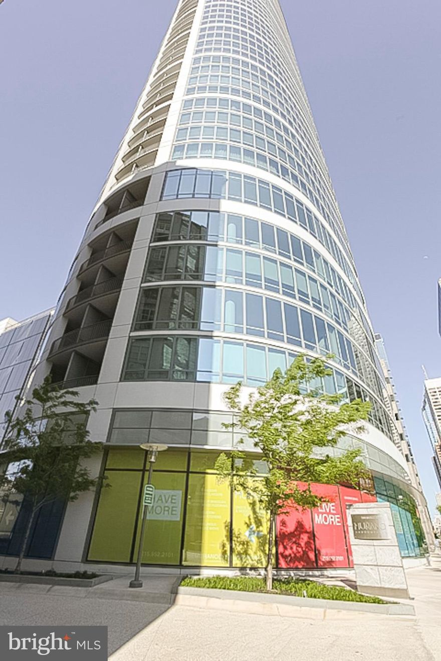 Spacious and luxurious "CURVED" Murano Condominium with amazing North and West facing views of Philadelphia! This 2-bedroom, 2-bath residence features modern and luxurious finishes including granite countertops, wood floors, stainless steel appliances, 9-foot ceilings with floor to ceiling windows. The price includes a reserved parking space in the attached covered garage, and a storage locker. The building features a 24HR Concierge, fitness center, a heated 60FT lap pool, renovated sundeck/community room and much, much more! The building is situated conveniently next door to Trader Joes and Wine & Spirits - and is just walking distance from Philadelphia's top-rated restaurants. Spend the day shopping in Rittenhouse, or enjoying the sights at Boathouse Row, you can't beat the location and attractions located right near the Murano! A must see! $400.00 Move in Fee. $31 per mo. parking garage maintenance fee.  Capital contribution fee due at settlement.  Storage locker included.