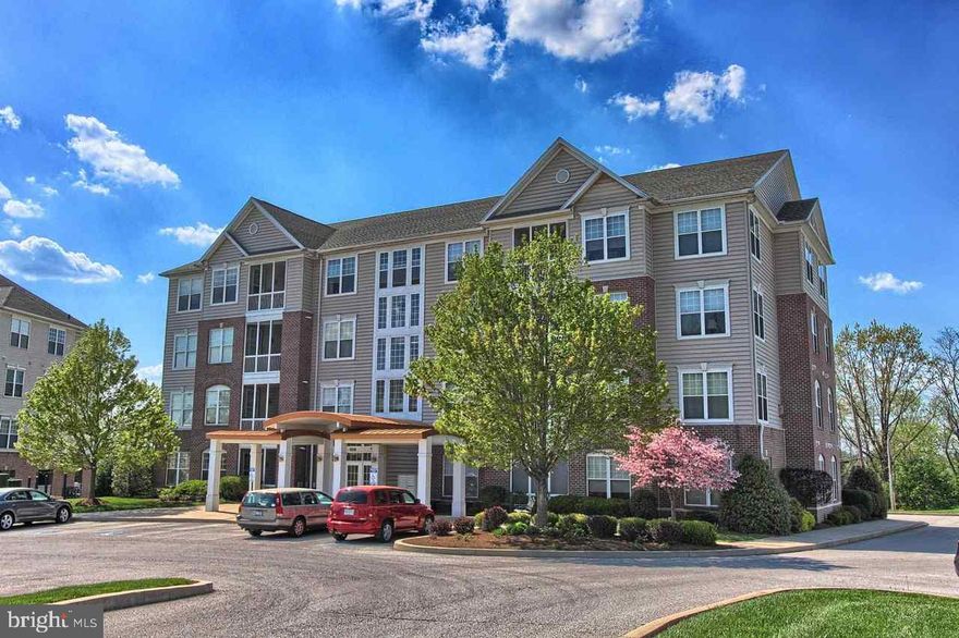 Enjoy this fabulous 55+ condo in gated community 2 BR 2 bath  Includes 1 Car Garage   secured bldg w/elevator private screened in porch & lovely views while you enjoy all the amenities of 1 flr living Hugh light & bright kit w/ceramic tile floors/kitchen island all appliances walk-in closets gas log FP Availability to community center w/golf/swimming/ex equip etc
