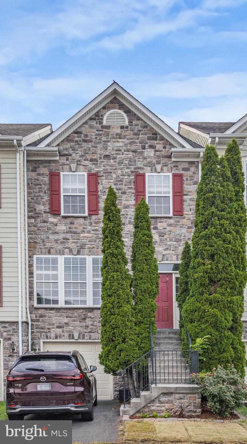 Welcome Home to This Stunning Stone-Front Townhome in the Heart of Leesburg
Discover comfort, style, and functionality in this beautifully updated stone-front townhome, ideally located in the heart of Leesburg. Featuring 3 bedrooms, 3.5 baths, and a garage with EV charger, this home blends elegant design with practical upgrades.
Step into the main level, where gleaming hardwood floors flow through the open living and dining areas, leading to a gourmet kitchen complete with a center island cooktop, expansive counter space, and rich cabinetry. A charming bay window niche features a custom-built bench seat with hidden storage—a perfect reading spot filled with natural light.
From the kitchen, walk out to a spacious deck with wrought iron balusters, ideal for entertaining or outdoor dining.
Upstairs, retreat to a luxurious owner’s suite with vaulted ceilings, a walk-in closet, and double doors that open into a spa-like bathroom with soaking tub and separate shower. Two additional bedrooms share a well-appointed hall bath, and a convenient upstairs laundry room adds to the home's functionality.
The lower level offers abundant natural light, a walk-out to a lush green yard and patio, and ample storage in the utility room and under the stairs. The garage features a brand-new garage door (2025) and dedicated car charger for EV owners.
Additional updates include a new roof (2025), adding peace of mind and enhancing the home’s curb appeal.
Don't miss this opportunity to own a beautifully maintained townhome with thoughtful details throughout—all just minutes from Leesburg’s shops, dining, and commuter routes.