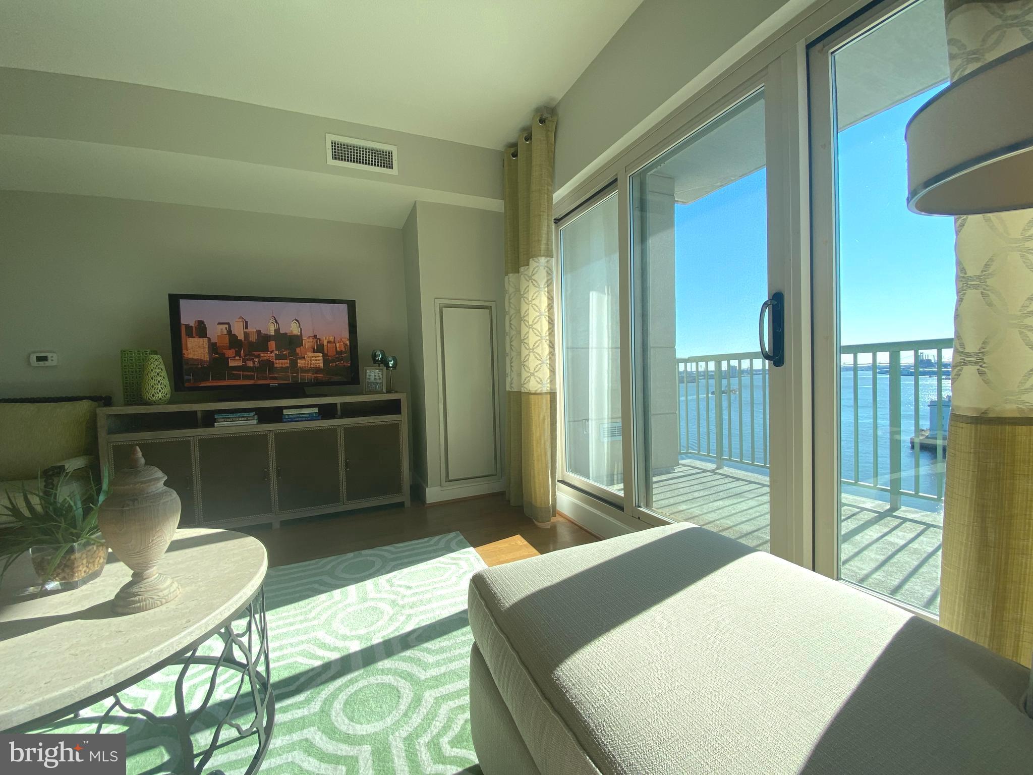 Price Reduced, on this Custom finished Builders Model! Unit 1113 Quick Move In, Builders Custom Model, Sunny South Facing Unit, with a beautiful water view from the 11th floor, this Ranger floor plan, Loaded with beautiful Designer finishes and upgrades throughout. The quality features at The Residences at Dockside include huge windows framing extraordinary city and river views, spacious designer kitchens, wired for high-speed and internet access. The amenities and conveniences that accompany Dockside include three levels of indoor parking space with security-gated access, one reserved parking space for each Dockside resident elegant lobby w/24 concierge, health and fitness facility, heated indoor swimming pool and hot tub, spacious community/entertainment room with party kitchen, big screen TV, surround sound system and expansive terrace with remarkable views. Virtual Tours Photos are exact unit, Shown By Appointment Only
Appointment Only. Appointments are not accepted via showing time.