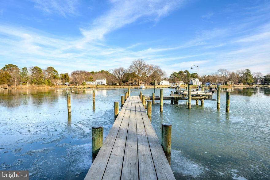 Private Harris Creek waterfront with pool, pier boat lift and deep water access—ideal for boating kayaking and quiet days on the water. Five bedrooms and three-and-a-half baths designed for a relaxed yet refined Eastern Shore lifestyle.
 Featuring  sun-filled interiors feature red oak floors custom built-ins multiple fireplaces and wide water views. The kitchen is designed for gathering with KitchenAid appliances granite counters a butler’s pantry dry bar and an oversized island Main-level living includes a waterside primary suite with fireplace and a private guest suite along with a flexible office or den.Upstairs offers three bedrooms a full bath and a spacious family room.
A screened porch expansive deck. saltwater pool and firepit patio create inviting outdoor spaces overlooking the water. Two-car garage with workshop whole-house generator and new septic system (2025).
An exceptional waterfront offering just minutes to St. Michaels and Easton.