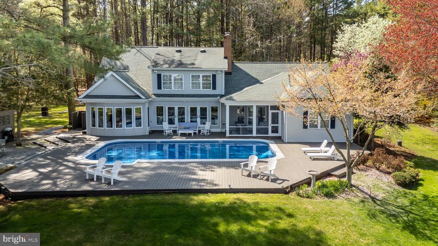 Private Harris Creek waterfront with pool, pier boat lift and deep water access—ideal for boating kayaking and quiet days on the water. Five bedrooms and three-and-a-half baths designed for a relaxed yet refined Eastern Shore lifestyle.
 Featuring  sun-filled interiors feature red oak floors custom built-ins multiple fireplaces and wide water views. The kitchen is designed for gathering with KitchenAid appliances granite counters a butler’s pantry dry bar and an oversized island Main-level living includes a waterside primary suite with fireplace and a private guest suite along with a flexible office or den.Upstairs offers three bedrooms a full bath and a spacious family room.
A screened porch expansive deck. saltwater pool and firepit patio create inviting outdoor spaces overlooking the water. Two-car garage with workshop whole-house generator and new septic system (2025).
An exceptional waterfront offering just minutes to St. Michaels and Easton.