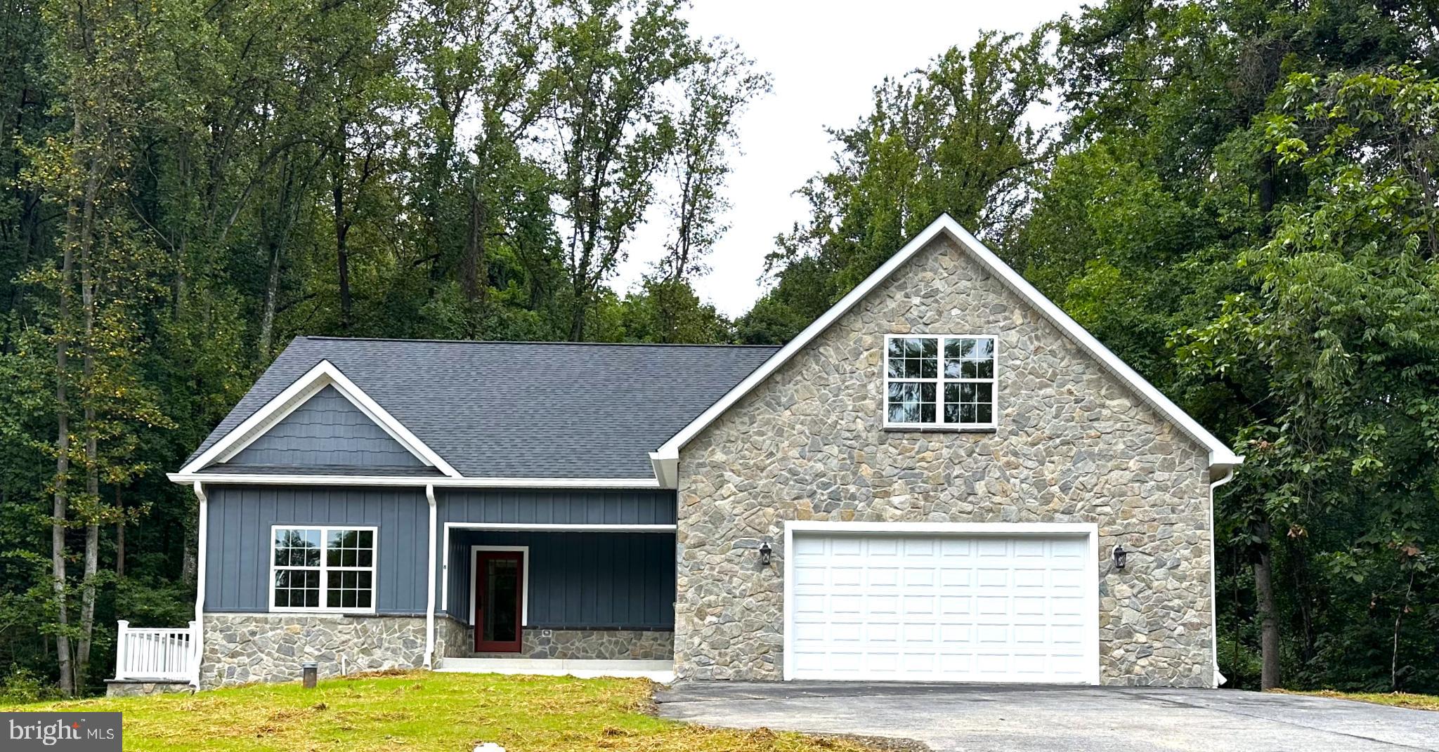 Brand new home with so many upgrades- quality throughout. Walk to the back side of the ski slope (need season pass) or just stay home and enjoy nature. Solid antique oak flooring, oversized kitchen with granite countertops. This house is huge and must be seen to appreciate it. Basement could be finished into playroom, pool room, wine cellar, man cave, home theater etc. rough in for basement bathroom, but the house already has 3.5 baths.... Will go just about any loan program 100% finished and ready to move in. Large walk in closet in primary bedroom, with private bath- home life was never so sweet