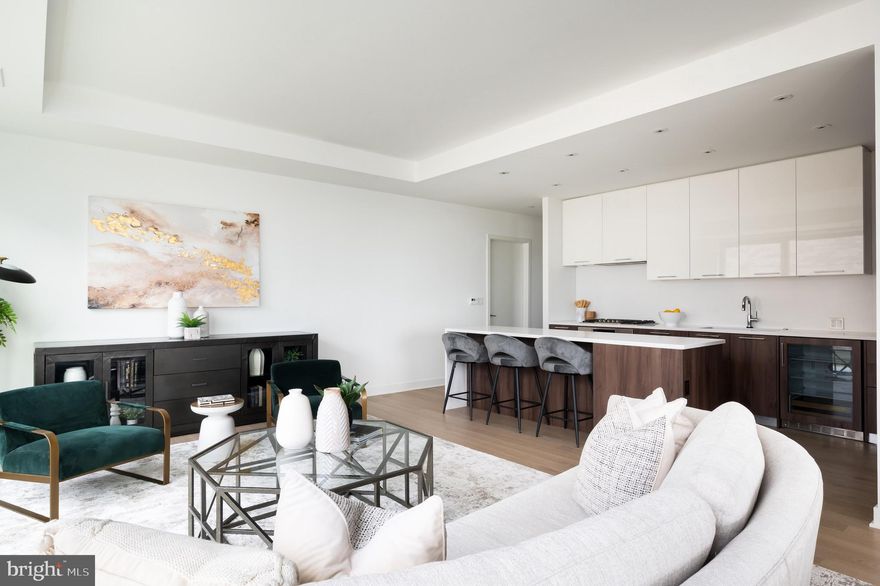 Gorgeous NEW condo with 2 bedrooms, 2.5  baths, & 3rd bedroom/den at Verse, Tysons luxury residential building at Boro. Home has never been lived in and being sold by builder with warranty intact! SW facing corner residence with 2 sides of floor to ceiling glass, 9'+ ceilings, 32' covered balcony, privacy galore at end of hallway, engineered wood flooring throughout, Canadian designed kitchen by Ceconni Simone with custom features, open floorpan with space for living and dining,  owner suite spa bath with water closet & double walk-in closets.  

Verse has it all.  24 hour concierge, automated package retrieval, pet spa,  gym, yoga room,  guest suite, pool, and massive Sky Park for entertaining, relaxing, or grilling out! Convenient walkable location with so much retail right downstairs such as  Movie Theater, Whole Foods, Bluestone Lane Cafe, North Italia, and Greensboro Metro Stop. Model in 1502. Last New home at VERSE!