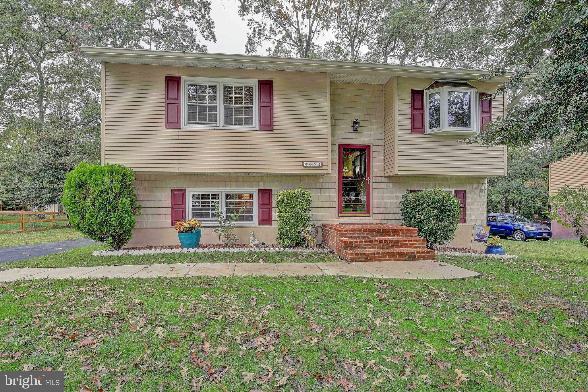 * Call for DAILY OPEN HOUSE Times * This is the property you've been waiting for - Original owner with many high-dollar upgrades! This home is tucked away in sought after Chelsea Beach, where you enjoy some of the best schools in the county - Chesapeake High School District. Easy commute to Fort Meade, Baltimore, Annapolis, or even D.C. IN-LAW SUITE potential downstairs. You'll notice the attention to detail and how well-kept and updated this home is. This home was well-built with 2 x 6 construction and the entire exterior has been redone - 30 year Architectural shingle roof with oversized 6" gutters that match the insulated vinyl siding (and leaf guards) were all installed less than 5 years ago. The tilt-out dual panel windows were replaced about 7 years ago and have a LIFETIME warranty - window breaks? - they send you a new one! Seriously! When you come through the front door, you'll see the interior railings have all been upgraded and the design gives a nice, open feel whether you look upstairs or down. Each step has stair nosing which protects the integrity of the carpet. Gorgeous bamboo wood flooring covers the hallway, kitchen and addition floors and neutral paint. Bay window brings in a lot of natural light to the living room. All the blinds that you see are custom wood blinds by Next Day Blinds. The kitchen was totally remodeled recently with real wood cabinetry, soft close doors and drawers, pantry cabinets, lots of lighting, repairable Corian countertops, and upgraded Maytag appliances. The kitchen has a breakfast bar and is open to the dining room. The upstairs has a nice open feel due to the new addition that was put on only a few years ago - vaulted wood plank ceiling, recessed lighting, a really nice fan and lots of windows complete this amazing space. There's a door to the side that leads to your newer, low-maintenance, oversized Trex Deck - amazing entertainment space! Going back inside and down the hallway you'll find a barn door that opens to the totally remodeled bathroom, complete with extended shower and upgraded tilework. Your primary bedroom has a remodeled attached half bath, and 2 closets. There's another spacious bedroom on this level. Downstairs is a large recreation room with brand new carpet, recessed lighting, full bath with gorgeous tiled shower and a large bedroom. Laundry room is here with Whirlpool washer and dryer on pedestals and extra storage space. The Rheem hot water heater cost a fortune but has a LIFETIME warranty - it's not made of metal so won't rust! The HVAC system has been upgraded a few years ago also. The heat here is oil heat and the newer tank is above ground behind the house, underneath the deck. You won't use as much oil as you'd think because of the insulated siding and energy efficient windows. The lower level also has a pellet stove which will heat a good part of the home during the cold months. There is an extra stash of pellets for you in the large Rubbermaid shed out back. Lifetime concrete septic tank and Culligan reverse osmosis water treatment system. Out back you'll find one of the most amazing detached garages ever with door openers, space for 5 cars, extra storage space workshop space with benches and cabinets, and it's own separate oil furnace. There is an air conditioning unit that you can put in and a BUZZER to the house so you'll be notified when dinners ready! You have to see this place to believe it - having this out-building along with the extra long driveway makes it perfect for a contractor or mechanic that does side work. Lots of space. In addition, there's a fenced area to the left side where you can keep a long RV, even 37 feet long - or a boat. There's exterior electric on this side of the garage so you can plug in during winter. Outside the garage is a paver patio, stone firepit, and real horseshoe pit. So many options with this yard. Make your appointment to come see this beauty in person!