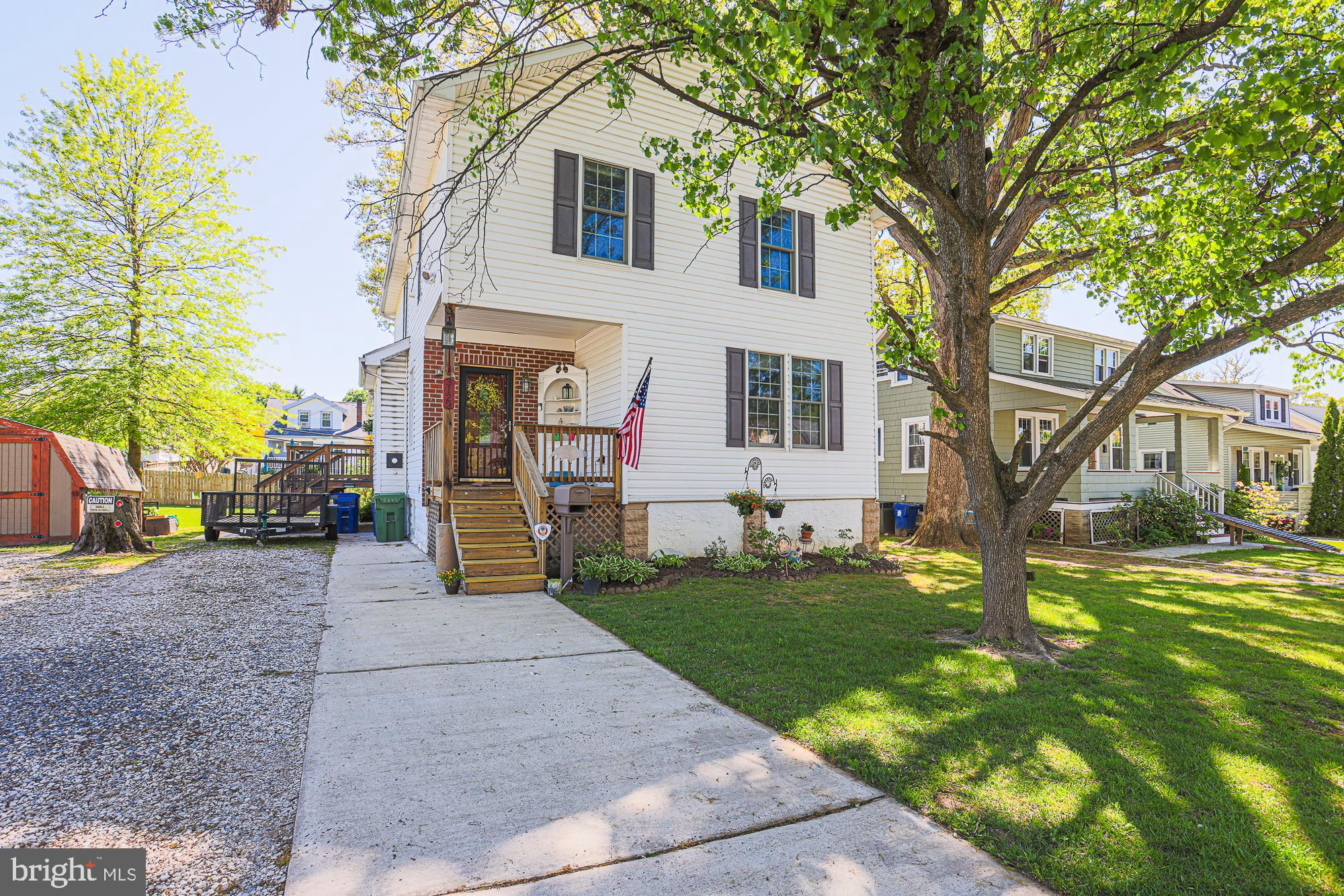 Welcome Home to this Gorgeous 6 bedroom 2 1/2 bath home in the desirable Parkville area. You enter this home from a Covered Front Porch with Custom Corner Built In. The First Floor has a Combination Dining Room and Living Room with Hardwood Flooring, Mudroom that enters onto 1 of the 2 Composite Decks with 2 sets of Stairs, 2 Large Bedrooms and Fully Remodeled Bath with Step in Shower, a Huge Eat In Kitchen with Stainless Steel appliances with Double Wall Oven (2024), Peninsula with Pendant Lighting, Pantry, and Sliding Doors that enter onto your 2nd Composite Deck overlooking the spacious back yard. Continue upstairs on the gorgeous Hardwood Stairs to 4 additional Large Bedrooms, another Fully Remodeled Bath and a 2nd Laundry Room with washer/dryer hook ups. The lower level has an additional Bonus Room that could be used for a home office, home gym or playroom, a Half Bath, Second Laundry area with washer and dryer, Laundry Tub, Counter Space for Folding Laundry and Cabinets for storage, and another large pantry, Basement has tons of storage and extra cabinets and shelving. This house is located on over a quarter acre lot and has many upgrades including Replacement Windows, New Storm Door, New Roof(2018) 50 year shingle, Tankless Hot Water Heater (2022). Pre Wired with Cat 5 Cable, Additional 100 amp service on Upper Level, Dual Zone Heat, Hook Up for a Pellet Stove, LVP Flooring, Pull down Attic with Steps, Fire Pit with extra wood in back yard, Recessed Lighting, Herb Garden, and a Workshop Area in basement with Extra Power Strips and 9 Ft Ceilings on the Main Floor. Home has been Freshly Painted throughout. Large Corner Lot! Located close to Restaurants, Parks, Shopping and easy access to Rt695. This home is a must see and one of a kind. Home Inspection, Pest and Radon inspections have been completed on this home and the seller is happy to share the reports. House appraised at $380,000, so you will have instant equity.