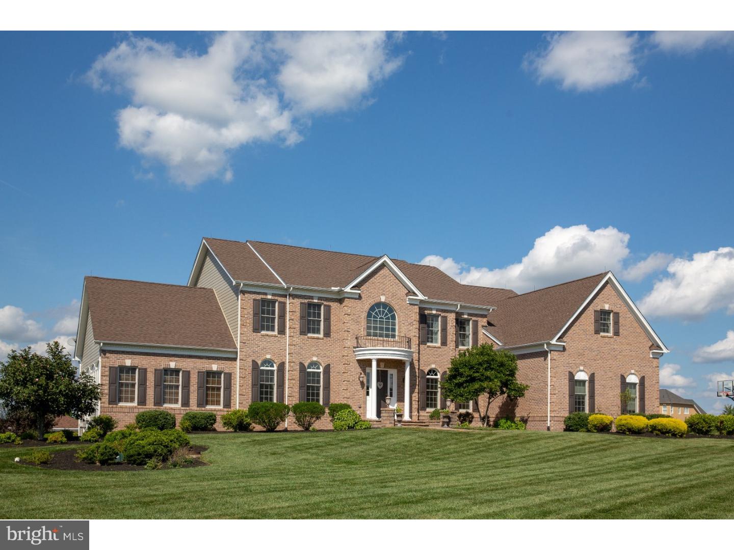 Come see this luxurious brick front estate home in Chapman's Corner with countless upgrades and one-of-a-kind views. A grand two story foyer with beautiful hardwood floors and an extravagant butterfly staircase immediately make an impression. Elegance embodies the Formal Dining and Living Rooms that is capped with double crown molding and rich millwork. Enjoy all four seasons in the expanded Conservatory that has its own separate zone for heating and cooling, vaulted ceiling, upgraded transom windows, and scenic mountain views. The 2 story Gathering room has a wall of windows, decorative coffered ceiling along with a gas fireplace and a back staircase to the upper level. The Study features hardwood floors and a perfect view of the pool and long distance views. A spacious gourmet kitchen is great for everyday living or lavish entertaining with a remarkable center island, granite countertops , six burner gas range , stainless steel appliances, wine refrigerator and an abundance of cherry cabinetry. This open concept continues with an eat in area open to a sun room with a cozy stone fireplace with easy access to the deck for alfresco dining. A half bath and Butler's pantry are the remaining amenities found on the first level. Heading upstairs by either staircase you will find an expansive master suite, complete with a sitting area, exposed columns, tray ceiling, a spa like bath with dual vanities, Jacuzzi soaking tub and a huge walk-in closet. Three additional bedrooms accompany the master, each with their own bath. There are endless possibilities with the fully finished basement with a full bath, possible au pair/bedroom, kitchenette, entertainment space, gym and a walkout to the back patio. Outdoor living has met its match with a beautifully landscaped yard with pool & spa, a large pavilion with built-in bar, and movie viewing with a pull down projection screen. Professionally decorated, meticulously maintained with complete exterior remediation to include new brick and Hardi-Plank allows ease of living. Come view this exceptional home and see all the upgrades that created a luxurious lifestyle at 137 Jane Chapman Drive.