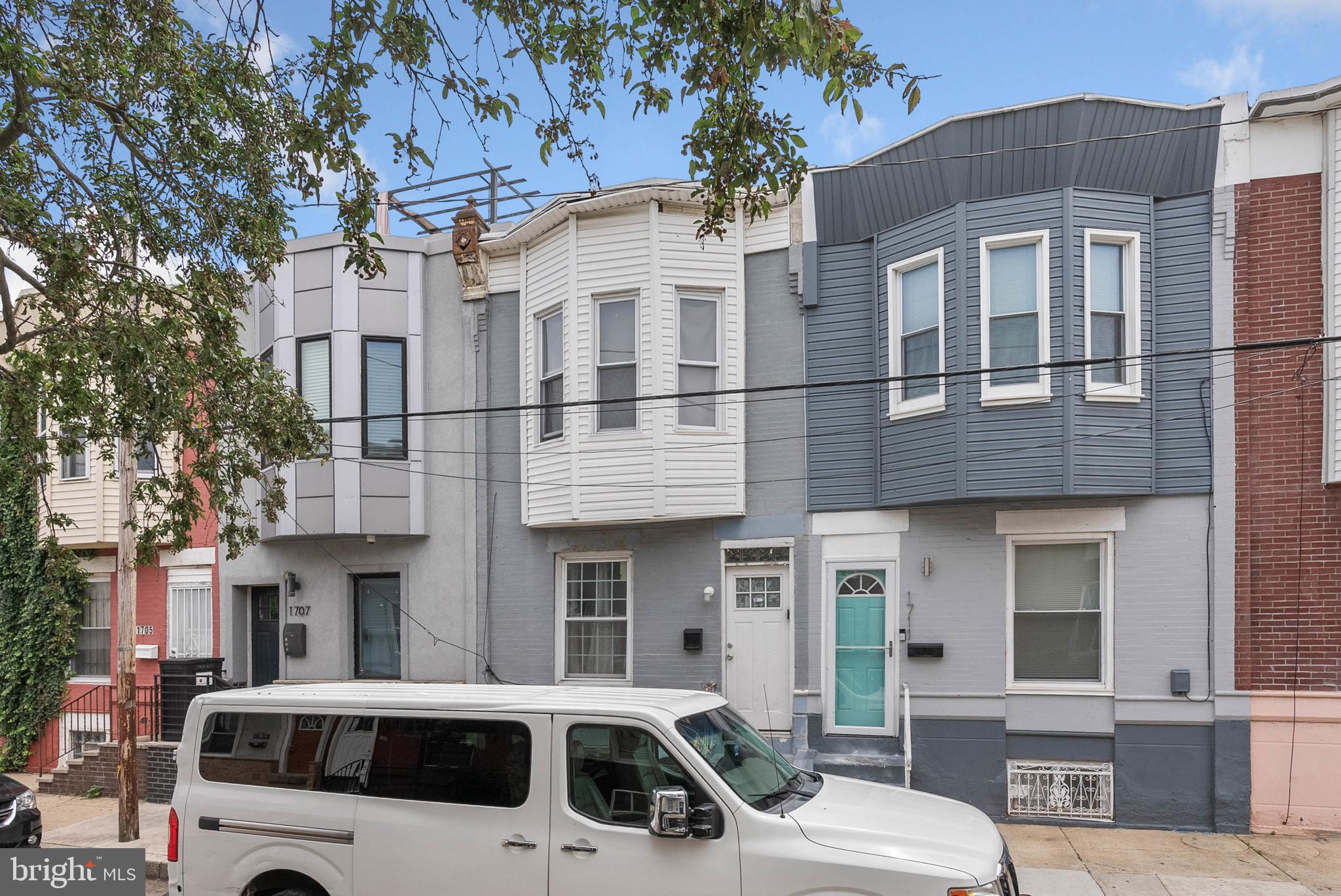 Tucked away on a quiet, low-traffic block in Point Breeze, you'll find 1709 S Ringgold St. This updated, move-in ready home has 2 bedrooms, 1 full bathroom, super low taxes and a private rear yard. A grey brick facade and an elevated entry welcomes you out front. Inside, the main level is open and airy, with modern floors and high ceilings. A large window at the front brightens the large living room, while the dining area at the center offers more space for entertaining. A sunlit kitchen is at the rear. Out back, the private patio is ideal for summer barbecues and dining under the stars. Upstairs, the primary bedroom boasts tall bay windows and a double closet. A second bright bedroom and a huge bathroom, with a soaking tub and standing shower, are down the hall. Completing the home is an expansive basement that provides tons of storage space. This home needs minor cosmetics, but is priced accordingly! In addition to everything inside, 1709 S Ringgold St is close to eateries, local shops, parks, and playgrounds. Popular shopping centers with stores like ShopRite, BJ's, and Home Depot are close, plus there's easy access to public transit and I-76. Schedule your tour today!