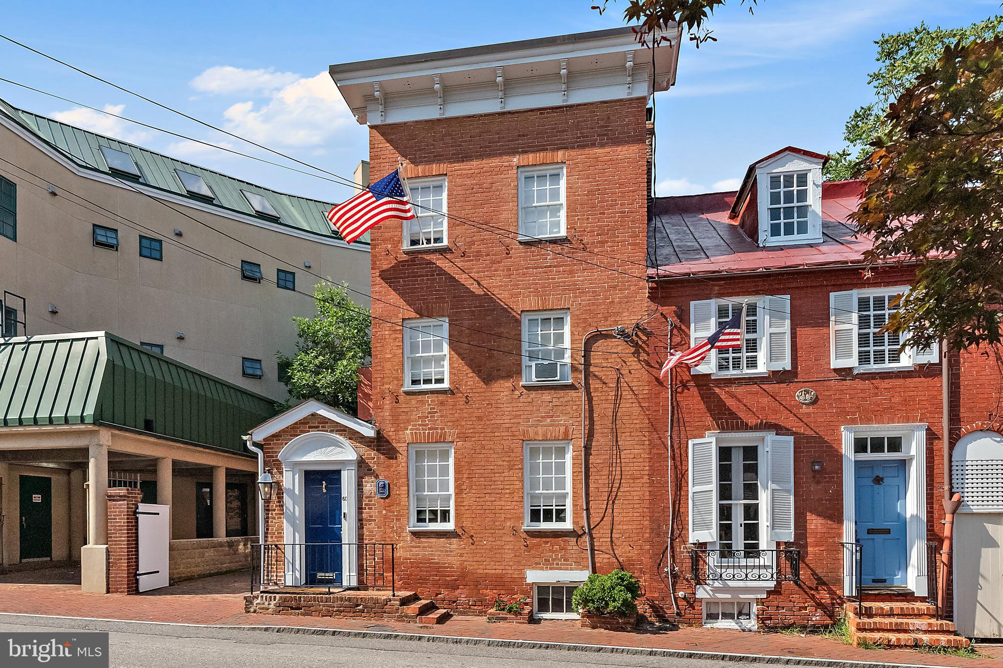 Exquisitely renovated, perfect in-town residence with parking in the shadow of the State House! From the moment you enter, you will be wowed with the pretty detail and lovely spaces on all three levels. Open kitchen has great space to entertain and dine and exceptional storage. Home was redesigned and renovated to maximize comfortable, beautiful and convenient downtown living. Home features lots of custom built ins, great fun fixtures and preserved original material such as heart pine floors. Primary suite has newly renovated bath and nice walk-in closet. 2nd newly renovated bath services the sunny front bedroom. On the 3rd level is another full bath and a large bedroom with built in beds for lots of sleepovers. Behind the gates find the private courtyard and patio which can be used for parking or entertaining. Cornhill is a most spectacular location with the State House on one end and the City Dock on the other. Downtown is at the door step along with dozens of restaurants, shops and a never ending parade of things to do and see!