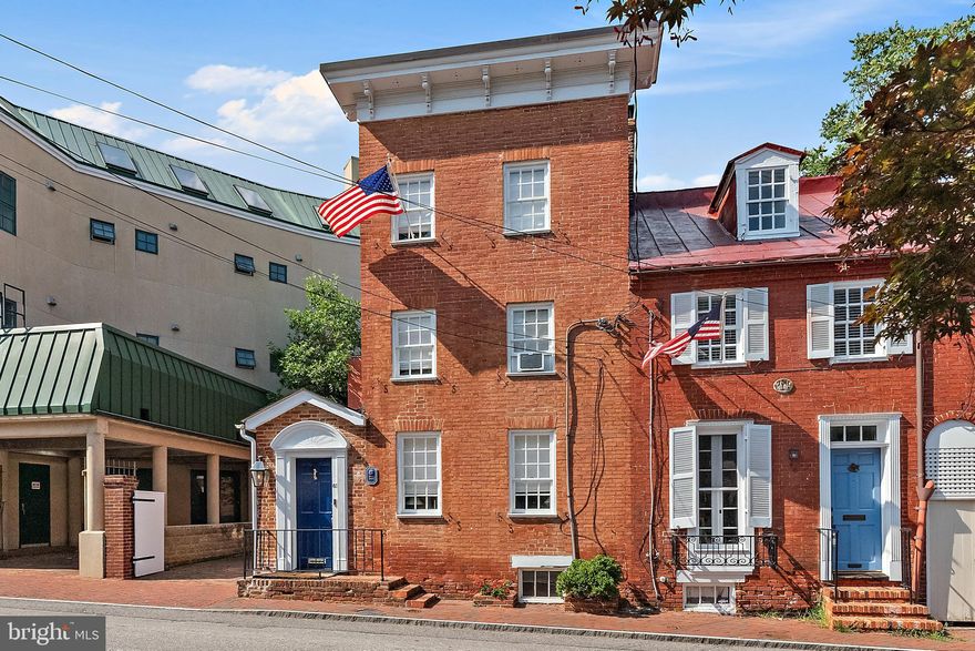 Exquisitely renovated, perfect in-town residence with parking in the shadow of the State House!  From the moment you enter, you will be wowed with the pretty detail and lovely spaces on all three levels.  Open kitchen  has great space to entertain and dine and exceptional storage. Home was redesigned and renovated to maximize comfortable, beautiful and convenient downtown living. Home features lots of custom built ins, great fun fixtures and preserved original material such as heart pine floors. Primary suite has newly renovated bath and nice walk-in closet.  2nd newly renovated bath services the sunny front bedroom. On the 3rd level is another full bath and a large bedroom with built in beds for lots of sleepovers.  Behind the gates  find the private courtyard and patio which can be used for parking or entertaining. Cornhill is a most spectacular location with the State House on one end and the City Dock on the other.  Downtown is at the door step along with dozens of restaurants, shops and a never ending parade of things to do and see!