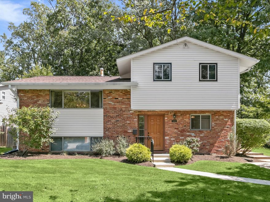 Welcome to this light-filled home in the desirable Montrose neighborhood of Rockville. Sited on a lovely lot with mature landscaping, this home offers wonderful outside privacy. A beautiful multi-level deck with built-in seating provides ample space for relaxing and for entertaining. A freshly painted interior, new flooring and refinished hardwood flooring, make this home truly move-in ready. 
The entry level features a large foyer, leading to two bright bedrooms each with a ceiling fan, closet, and parquet wood flooring; a full bath completes this level. A stairway in the foyer opens to the large living room with a picture window and stunning hardwood floors. An arched doorway welcomes you to the formal dining room also with hardwood floors and access to the kitchen. A side hall features a powder room; 3 large storage or pantry closets and bookshelves, also leads to the kitchen. The kitchen will bring delight to any cook! With the large center island, ample counter and cabinet space, breakfast nook, built-in desk, greenhouse window, double ovens, new refrigerator and dishwasher, skylight and French door leading to the deck – it has it all! The laundry room is adjacent to the kitchen and features storage cabinets and a door to the deck and back yard.
The upper level highlights the primary bedroom with a walk-in closet, ceiling fan, and sitting room. The primary bath includes a jetted tub shower.
The lower level includes a recreation room with new luxury vinyl wood-look flooring, a cedar closet and storage closet for games or hobbies. There is a full bath on this level as well as a partial kitchen with new dishwasher. An entry door provides access to the side yard.
A great location, close to the Twinbrook Metro, enjoy shopping and the many restaurants at Congressional Plaza, Federal Plaza, Montrose Crossing, Pike & Rose and the new Wegman’s on Rockville Pike. Commuters will appreciate the proximity to major routes like I-270 and I-495. This home offers a rare combination of urban convenience and welcoming community living. Welcome home!