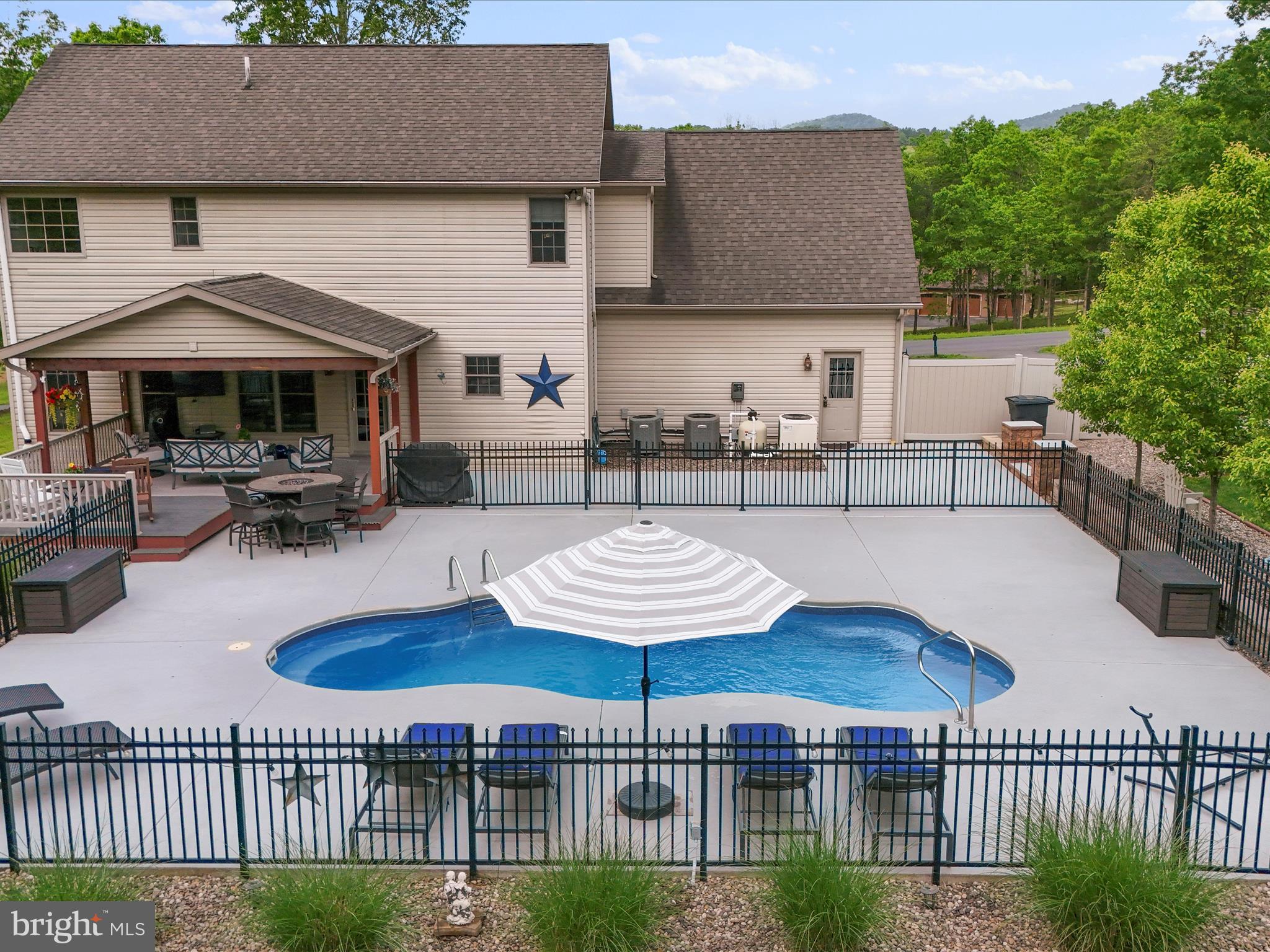 Welcome to your beautiful home in the Lakewood subdivision in West Virginia! Lakewood is one of the premier neighborhoods featuring a private 50-acre lake. This stately colonial home features 4 spacious bedrooms, 2.5 bathrooms, and over half an acre of tranquil outdoor living space with mature landscaping all around. The outdoor living space features a heated inground pool that is just about ready to be opened back up for your summer enjoyment! The main level of the home features a large foyer space, kitchen with granite counters, plenty of cabinets and breakfast area, formal dining room, over-sized family room and powder room. Let's head upstairs to the spacious primary suite with separate tub/shower and 2 vanity areas & great closet space. Three additional bedrooms, a full bathroom and a laundry area finish off the upper level. The basement offers plenty of storage and additional space that could easily be finished for your needs. Just a short distance from your new home is the lake access for swimming, kayaking, or fishing. The community offers additional amenities, including basketball courts, a playground, and walking trails. Located just minutes from Cumberland, MD, and less than two hours from the Northern VA & DC Metro Region.