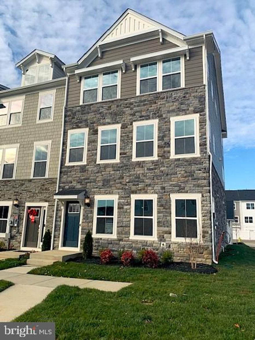 Immediate, Move-in Ready Home.
This amazing Ellicott townhome has 2,736 sq. ft. with 3 bedrooms, 2 full baths and 2 half baths, 2 car garage with 2 additional parking spaces .  Situated on the first floor, two versatile flex spaces on main level can be used as a recreation room for family games, comfortable lounging, and home office.  Enhancing the convenience and functionality of the first level is a half bathroom.  You will have excess to the backyard for outdoor living space. On the second level the kitchen is equipped with an oversized center island that doubles a breakfast bar, sparkling granite countertops, stainless steel appliances, designer cabinetry and a roomy pantry.  Ample countertop space that provides plenty of room for food prep and casual meals.  The Dining room is fit for casual weekend brunches and upscale celebrations alike.  The sun-drenched family room flows to the kitchen to make everyday living a breeze, and you will find a powder room for convenience on this level.  The third level owner’s suite features a spa-inspired bathroom with a glass-enclosed shower with built-in seating, double vanities and a generous walk-in closet, plus an optional tray ceiling.  The owner’s bathroom has dual sinks, and a generous glass-enclosed shower make mornings simple.  A separate commode area adds an extra layer of privacy to the en-suite bathroom.  Built-in shelving optimizes this spacious walk-in closet for organizing wardrobes, shoe collections, accessories and linens.  Two secondary bedrooms are situated down the hall from the owner’s suite.  There’s a full bathroom shared between the secondary bedrooms.   The laundry room is conveniently located among the bedrooms on the second floor, which helps simplify household tasks.
The photos provided are for illustration purposes only, and not of actual home.
Homeowners will enjoy an onsite community center, swimming pool, exercise room, dog parks, tot lots, and walking trails.  St. Charles Highlands is near great shops, restaurants, parks, and golf courses for outdoor activities. The Capital Beltway offers easy access to Washington, D.C.