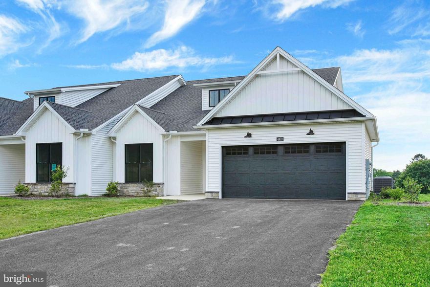 Welcome to the Range Neighborhood in Penn National Community! Discover a friendly, maintenance-free neighborhood of charming modern farmhouse style homes that are right-sized for your lifestyle. This home features two bedrooms, two baths, and a great room that is open to the kitchen area.  Great room has gas fireplace. Screened rear porch. Primary suite features a custom tile shower. Walkup storage room on upper level. HOA fee is $145 per month and covers lawn care, snow removal, and trash. Penn National Community offers 36 holes of 4-star golf, outdoor pool, tennis/pickleball, yoga, community garden, 40 + social clubs, restaurant/bar, and so much more!!