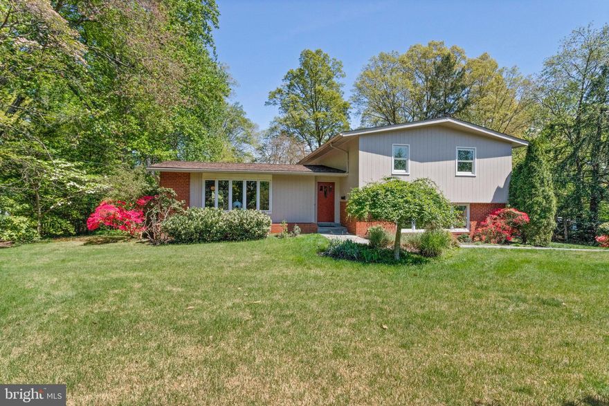 Welcome to this stunning 4-level home with a contemporary flair, ideally located in the heart of Mantua on a beautifully landscaped half-acre lot. With thoughtful updates, abundant natural light, and a flexible layout, this home offers both comfort and modern style in one of Fairfax's most sought-after neighborhoods.

Step inside to a bright and spacious living and dining area with vaulted ceilings and gleaming hardwood floors. The large eat-in kitchen features brand-new Quartz countertops, stylish Luxury Vinyl Tile flooring, and stainless steel appliances—perfect for cooking, hosting, or everyday meals with the family.  Walk out through French door to flagstone patio for outdoor entertaining and serene views of yard. 

Upstairs, you’ll find four generously sized bedrooms and three full bathrooms, all on the same level. Two of the bedrooms feature their own en suite bathrooms, including an added primary suite with a luxurious and stylish bathroom complete with double sinks, a large shower, and a walk-in closet with custom shelving and cabinetry. The original primary suite also has its own private bath, making this home ideal for multigenerational living or hosting guests with ease.

The lower level is warm and inviting, with a cozy family room featuring a wood-burning fireplace and built-in window seat. A large picture window offers a lovely view of the  front yard—perfect for your pets to perch on the bench and watch the birds in the garden. Just below, the second lower level offers even more versatility, with ample storage, a bonus room perfect as a home office or guest room, and an oversized two-car garage tucked away at the rear of the home.

Outside, the fenced backyard is a true oasis with lush perennials, mature landscaping, and a charming herb garden along the side. Nature lovers will appreciate the serene setting and peaceful views.

This home includes many recent upgrades, including new carpet and LVT flooring in 2024, a 2018 heat pump with oil backup for dual fuel efficiency, and Pella replacement windows on the main floor. With public water and sewer, no HOA, and low monthly utilities, this property offers convenience without compromise.   At the rear there is a 2 car garage with  a good size turn around and extra parking space. 

Families will love being just steps from Mantua Elementary, the neighborhood’s popular walking loop on Colesbury Place, and nearby playing fields and a tot lot. You'll also enjoy easy access to the Vienna Metro, Mosaic District, Inova Fairfax Hospital, and the acclaimed Woodson High School pyramid. The community’s popular Mantua Swim and Tennis Club and nearby parkland and trails add to the vibrant neighborhood feel.

Join us for an Open House on Sunday, April 27, from 2 to 4 PM, and see why this one-of-a-kind home is everything you’ve been waiting for.