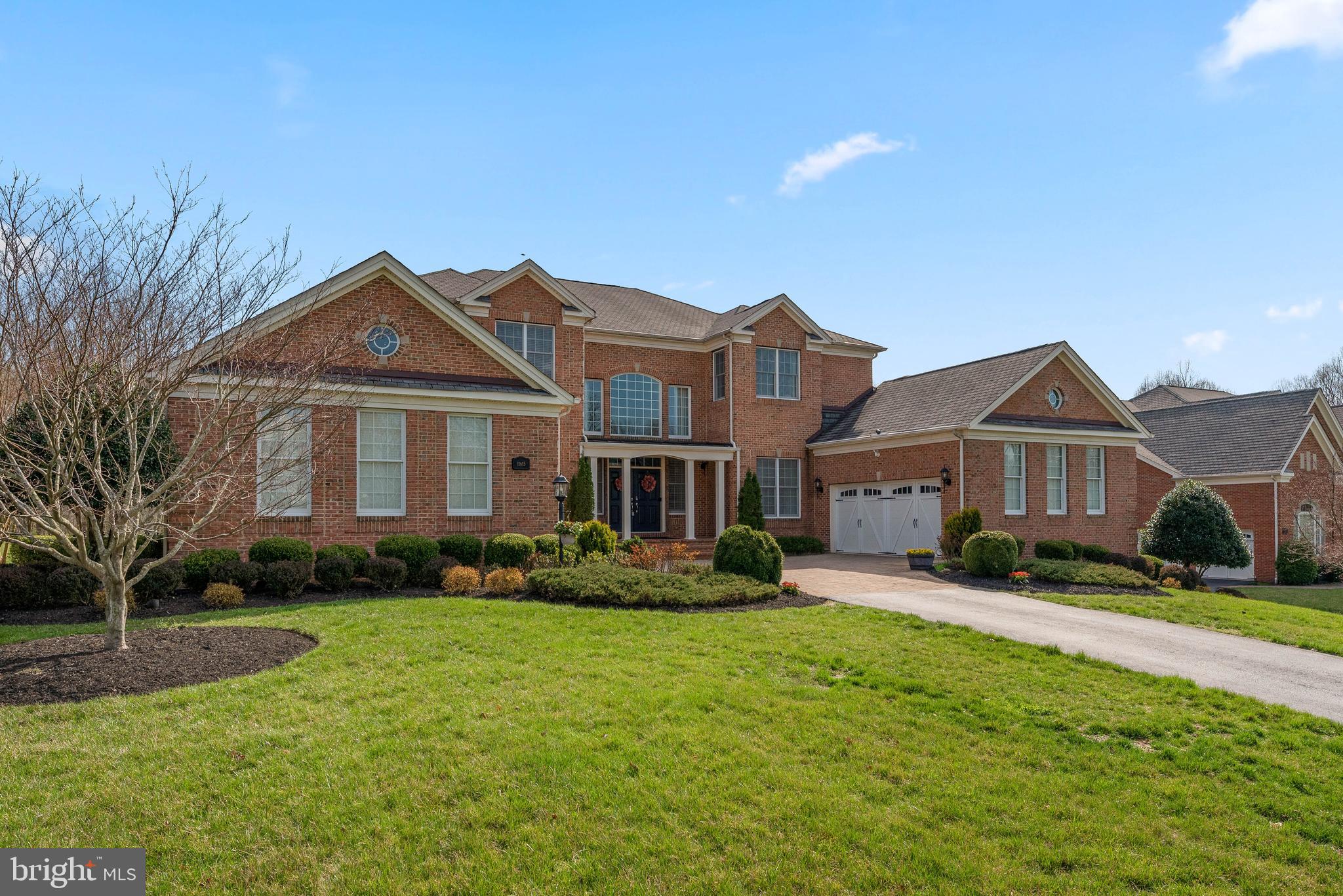A quiet cul-de-sac guides you and your guests to a monument entrance and a flourishing paver courtyard approach announcing this estate offering 9,023 finished square feet located in prestigious Patuxent Chase! Grand two-story foyer with dual curved staircase opens to a two-story dining room with columned entry and large windows. Entertain in the formal living room with tray ceilings, architectural wall feature, and open sunroom with panoramic views. Work from home in gorgeous main level library/study with rich floor to ceiling cherry built-in bookcases! Open family room with stacked crown moldings and granite two-sided fireplace to conservatory with open views! Gourmet kitchen with large breakfast room, granite counters, stainless appliances, custom cabinets, center island, and walk-in pantry. Expansive main level guest suite with attached bath and walk-in closet is perfect for hosting over the holidays! Upper level hosts four spacious bedrooms each with attached bath and roomy closets including owner's suite with two custom walk-in closets and luxe attached bath with jetted tub and frameless shower! Fully finished lower level with 5th bedroom, full bath, large bonus room, media room with theater seating and built-ins, sprawling rec room, and granite wet bar for the ultimate entertainer!