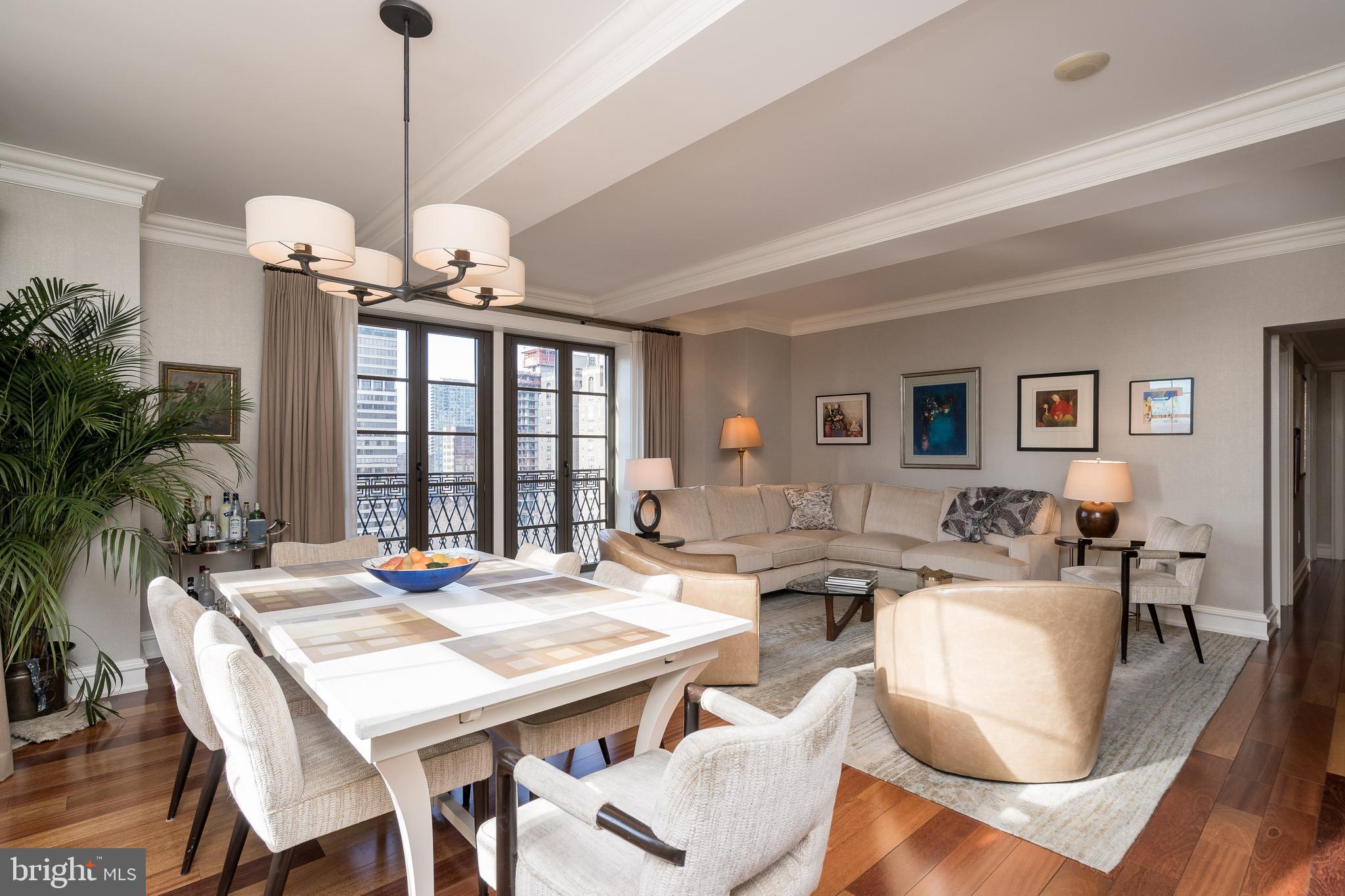 Three bedroom, three bathroom with beautiful appointments, high-end finishes and direct views of Rittenhouse Square from every room. Enter the home into a corner, light-filled great room with south-facing windows and a Juliet balcony that showcases sunset views over Rittenhouse Square. The kitchen opens to the great room and features rich wood cabinetry, granite countertops, Sub-Zero and GE appliances and a breakfast bar. The master bedroom has neutral wallpaper, custom fit-out walk-in closets, a second Juliet balcony over Rittenhouse Square and an ensuite bathroom with floor-to-ceiling marble tile work, a double vanity, private commode, tub and walk-in shower. The second and third bedrooms each have wall closets and enjoy easy access to full hall bathrooms, also appointed in marble. Additional home highlights include extensive millwork, stylish light fixtures, custom window treatments and a washer/dryer in the unit. No detail was left undone, this home is in excellent condition and ready for its next owner to move right in. Sale price includes a 71 square foot storage unit. There is a parking spot in the building's garage available for purchase for $75,000. Residents of Parc Rittenhouse enjoy a 24-hour doorman/concierge, state-of-the-art fitness center, clubroom and boardroom and a seventh-floor rooftop club featuring an outdoor pool, whirlpool spa, kiddy pool and sundeck with lounge chairs. Tax abatement through 2023.