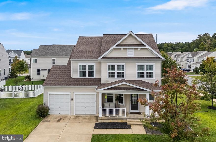 A large corner lot, in the heart of Wildewood - this beautiful home is ready for its new owner! A welcoming front porch, to enjoy the community feel of Woodland Park, brings you inside where you are greeted with gleaming hardwood floors and tall ceilings. The entry offers a designated dining room, half bathroom and a seamless transition from the kitchen to the large living room. This gourmet kitchen offers stainless steel appliances, a gas cooktop, island seating, a pantry, plenty of cabinet space, a tile backsplash, granite counters and under cabinet lighting. The breakfast nook leads you out onto your brick patio, perfect for entertaining! Upstairs you will find 3 large bedrooms, all with walk-in closets. The owners suite has a huge walk-in closet, double sinks and a separate soaking tub. The large laundry room is ideal for doing laundry and avoiding the steps, plus there are two hallway storage closets for all your linens. The basement is fully finished with LVP flooring, another bedroom (making this the 4th one) and another full bathroom. Great for a guest! The large rec room is perfect for extra entertaining space and the large storage area is ideal for seasonal decor or storage! All windows are fixed with blinds, the roof was replaced in 2023, the yard has a sprinkler system for easy maintenance and the 2 car garage has additional cabinets for even more storage. Make this adorable house, your home! Seller is giving $5,000 (Five Thousand Dollars) towards a paint credit.