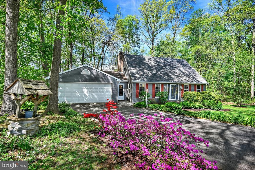On the picturesque countryside of New Park, PA in Southeastern Schools, this 4 bed, 2.5 bath home exudes warmth and charm, with an over sized two car garage and workshop on 1.05 wooded acres.
On the main floor, enjoy cold evenings in the family room while cozying up to the propane fireplace insert. The kitchen has beautiful hardwood floors, updated cabinetry with plenty of storage, deep double bowl sink and pantry. Also on the main floor are a formal dining room, living room, updated powder room and 4th bedroom/office. 
Upstairs you will find a large primary bedroom with primary bathroom, hardwood floors, electric fireplace, and sliding doors that steps onto a balcony overlooking the wooded backyard. Also, upstairs are two additional bedrooms as well as a second full bathroom.
On the lower level you will find a finished basement with new LVP flooring, large den with wet bar, office/hobby room, as well as a utility room with laundry and wash tub. There is a Bilco door exit from the basement to the backyard. 
Attached to the oversized two car garage is a large heated workshop with tons of storage and counter space. The enclosed breezeway is perfect for a mudroom. 
 Step outside to discover your own private wooded oasis,  perfect for outdoor entertaining or simply unwinding amidst nature's beauty.  In the warmer seasons enjoy sitting outside on the various decks overlooking beautiful flower gardens and abundance of wild life.  ** HOME WARRANTY INCLUDED**