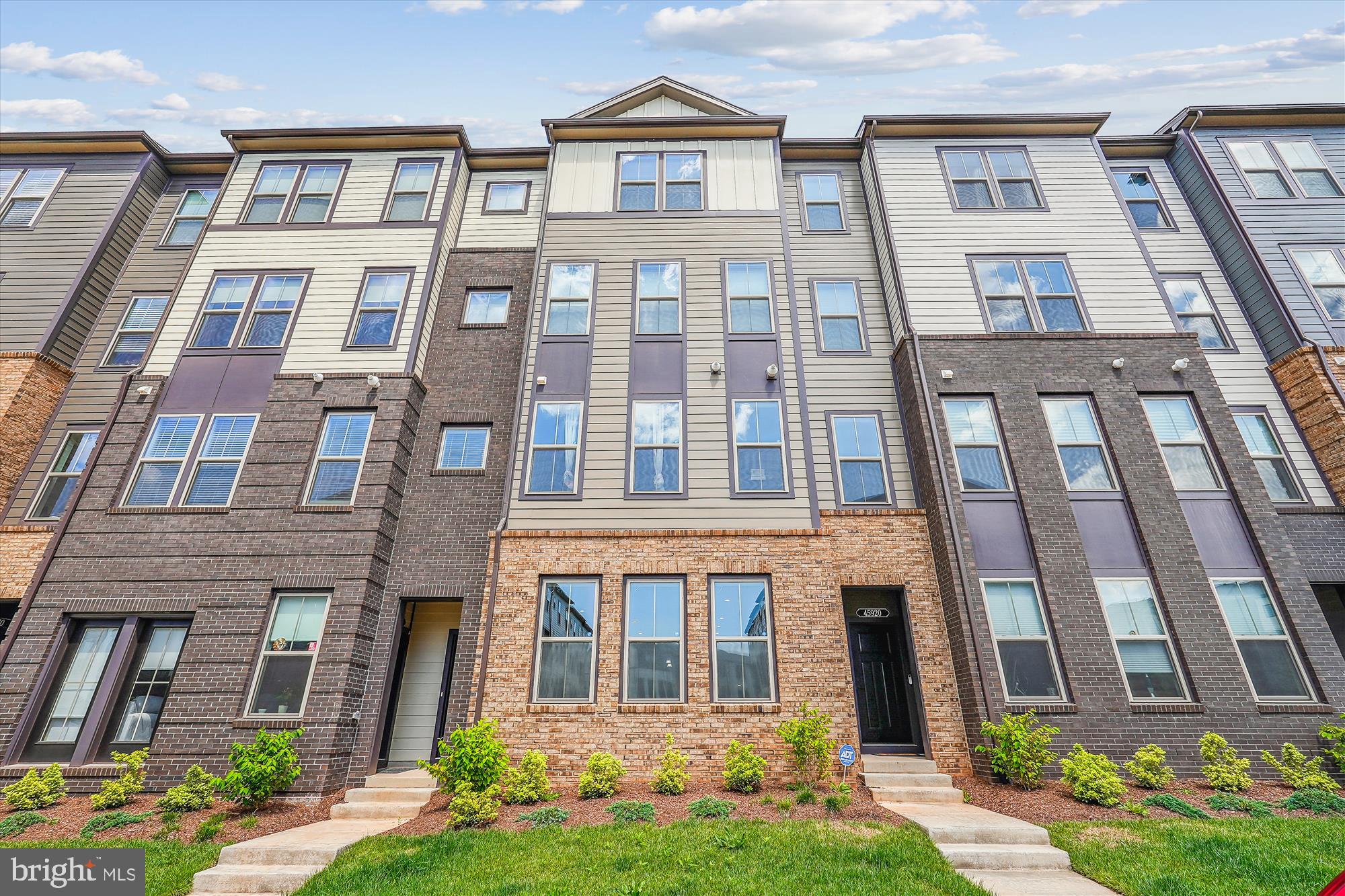 Welcome to your new home in the SOLD OUT Regal Chase community of Sterling, VA. This beautiful Monroe model townhome-style condo offers a perfect blend of comfort and convenience. Lightly lived in and ready for your immediate occupancy. Enjoy an open floor plan with a spacious living area and a modern gourmet kitchen equipped with upgraded tile backsplash, stainless steel appliances, a double oven and under cabinet lighting. With 3 bedrooms and 2.5 bathrooms, this unit lives like a house, complete with a built in security system, motorized blinds throughout, wall mounted storage shelves have been put up and an indoor EV charger installed in the garage, two updated walk-in closets, and a spa-inspired en-suite bath with custom tile and a walk-in shower equipped with a seat. Relax on your private balcony, located off the primary suite. Situated just off Routes 7 and 28, enjoy quick access to multiple shopping centers, dining options, and outdoor recreation, along with community amenities like an outdoor gym facility, multiple playgrounds, dog park, volleyball and tennis courts.