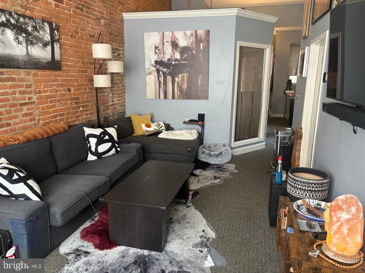 Welcome to 1412 Light Street, a spacious and versatile first-floor unit located in the heart of Federal Hill—just steps from Cross Street Market, neighborhood bars, restaurants, shops, and the Inner Harbor waterfront. This unit features a large primary bedroom, two additional flex rooms perfect for a guest room, office, or creative space, and 1.5 bathrooms. Ideal for both commuters and remote workers, the layout offers high ceilings, a kitchenette, and a private outdoor patio and entryway for added comfort and convenience.
The full, unfinished basement provides tons of storage, a half bath, and endless potential for workshop or hobby use. Additional features include in-unit laundry, a smoke-free environment, and included storage space. Rent is $2,000/month on a 12-month lease, with all utilities covered except the individual electric bill. Don’t miss your chance to live in one of Baltimore’s most vibrant and walkable neighborhoods!