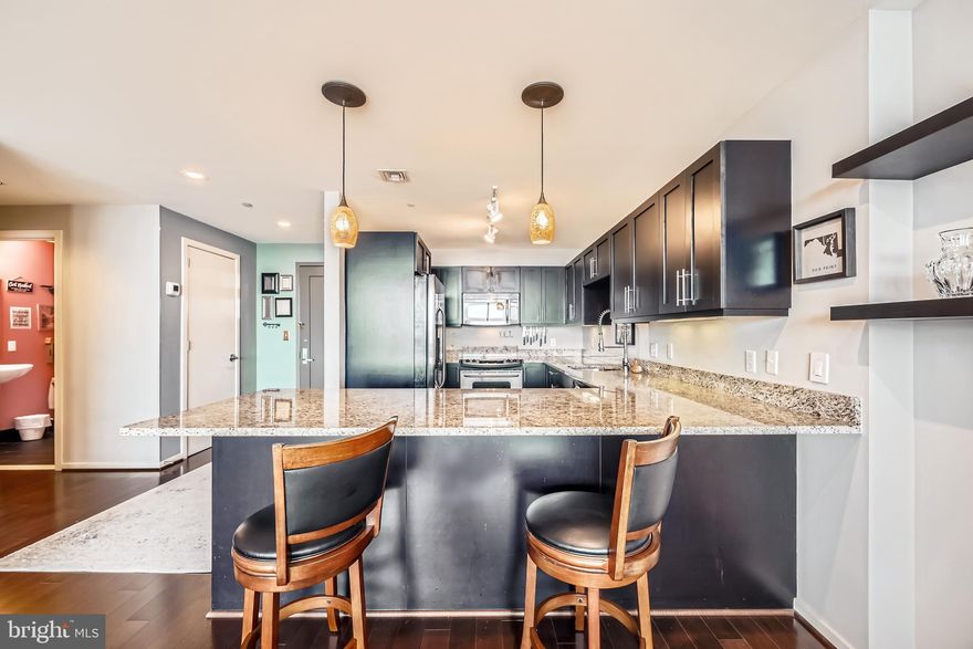 Welcome to refined living at 1200 Steuart Street, a premier high-rise residence in the heart of Baltimore. This expansive 1,859-square-foot home offers sophistication and comfort, featuring two generously sized bedrooms and 2.5 well-appointed bathrooms.
As you enter the home, you're immediately greeted by sweeping panoramic views that stretch across the harbor and skyline, visible through floor-to-ceiling windows that fill the space with natural light. The entryway opens into a seamless living and dining area, enhanced by recessed and track lighting that highlights the clean, modern design.
The gourmet kitchen is thoughtfully designed with high-end finishes, ideal for everyday cooking or entertaining guests. A spacious balcony with multiple exposures—including northeast, east, and south—invites both morning light and vibrant city views.
The primary suite offers a quiet retreat, complete with a custom walk-in closet and a spa-inspired ensuite bath featuring a double vanity, soaking tub, and separate shower. The second bedroom also offers generous storage and its own private bath, making it perfect for guests or accommodating flexible living needs.
Additional features include a dedicated laundry room with in-unit washer and dryer, as well as two ideally located garage parking spaces with options to rent or purchase additional spaces.
Residents enjoy access to a full suite of amenities, including a fitness center, yoga studio, game room, resident lounge, media room, and landscaped courtyard. A comprehensive security system and 24-hour concierge-level services add convenience and peace of mind.
Experience elevated city living in one of Baltimore’s most desirable condominium communities.
Luxury, convenience, and views—this condo delivers it all.