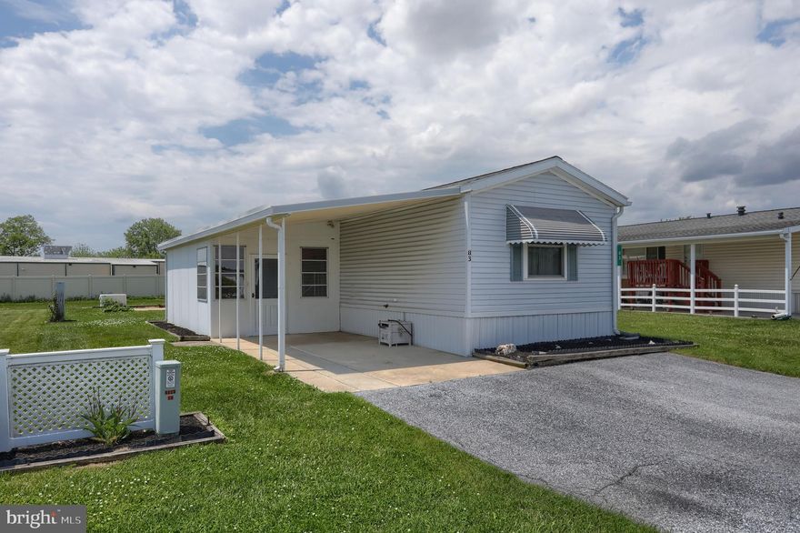 Welcome to Country Acres Gold MHP in Myerstown! This well-maintained 2-bedroom, 2-bathroom manufactured home is in a desirable 50+ community and ready for new owners. The spacious eat-in kitchen offers an abundance of cabinet and storage space, making meal prep and organization a breeze with plenty of room for a kitchen table. The well-sized family room provides a comfortable space to relax or entertain. The rear bedroom features beautiful built-in cabinetry and a desk area, perfect for added storage or a hobby/workspace. Both full bathrooms include showers. A convenient laundry area is located just off the kitchen near the side porch. Relax and unwind in the enclosed patio area, ideal for enjoying your morning coffee or hosting guests. The attached carport provides protection from inclement weather and added everyday convenience. This home also includes a Generac whole-home generator, giving you peace of mind during power outages. Don’t miss this wonderful opportunity!
Lot rent is $435/month.  Water-$16.50/month, Sewer- $50/month, Trash - $15/month