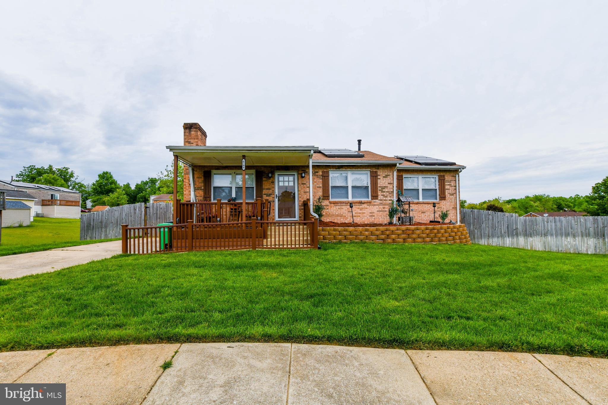 This stately updated brick raised rambler allows you to buy a single family home at a townhouse price. This jewel is located on a quiet cul-de-sac in the sought after Keystate Estates. When walking up to the house the surpremly manicured lawn will grab your attention. Enter to gleaming hardwood floors in the sun filled living room that includes a fireplace and instantly feel at home. The beautiful open kitchen includes 42 inch cabinets, stainless appliances, granite counters, and recess lights. Meals can be enjoyed at the kitchen sitting bar or in the formal dining room. The main level also includes an addition that can be used for a second family room, office or whatever your heart desires. The main suite includes a private full bath and a walk in closet. The main level also includes two additional bedrooms and another bath. The fully finished basement includes another bedroom, a full bath, a laundry room and recreation room. The basement, which includes a second fireplace is large, but gatherings can also spill out to the huge fenced in rear yard. This yard is an entertainer's dream where all the family functions can be held. Relax on the freshly repaired deck, gather around the firepit or enjoy the incredibly spaced yard. This home offers off street parking, custom paint, some new fixtures, updated mechanicals and appliances and much more. This incredible property is a must see. Solar Lease Must Convey