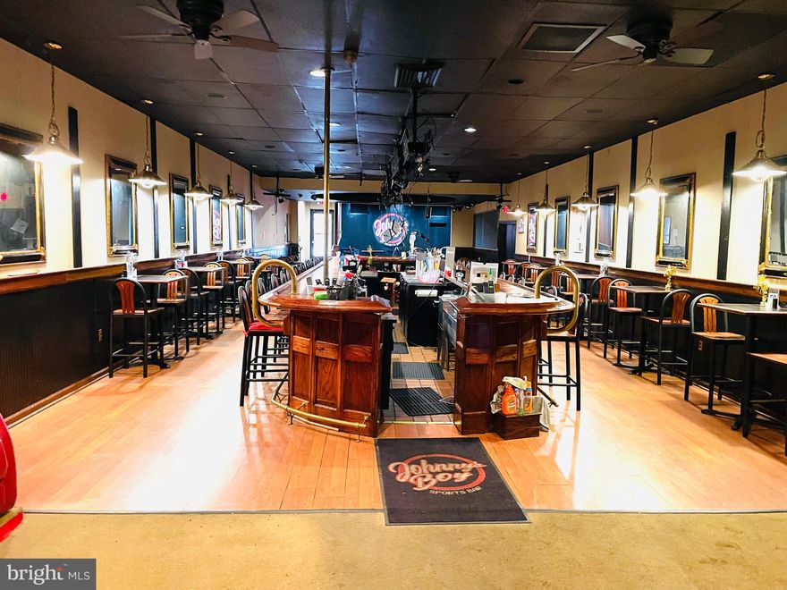 Bar/Restaurant located in downtown Martinsburg. Main bar/dining area has a stage for entertainment. In addition, there is also a separate private bar/lounge area. Upstairs there is space that can be turned into an apartment or office space to generate additional income. The basement offers storage areas.  There is access from either end of the building with street parking and a public parking lot. This is a 5600+ sq. ft. building located in a well populated area with over 66,000 people within a ten mile radius. Bring your business savvy and explore your possibilities!